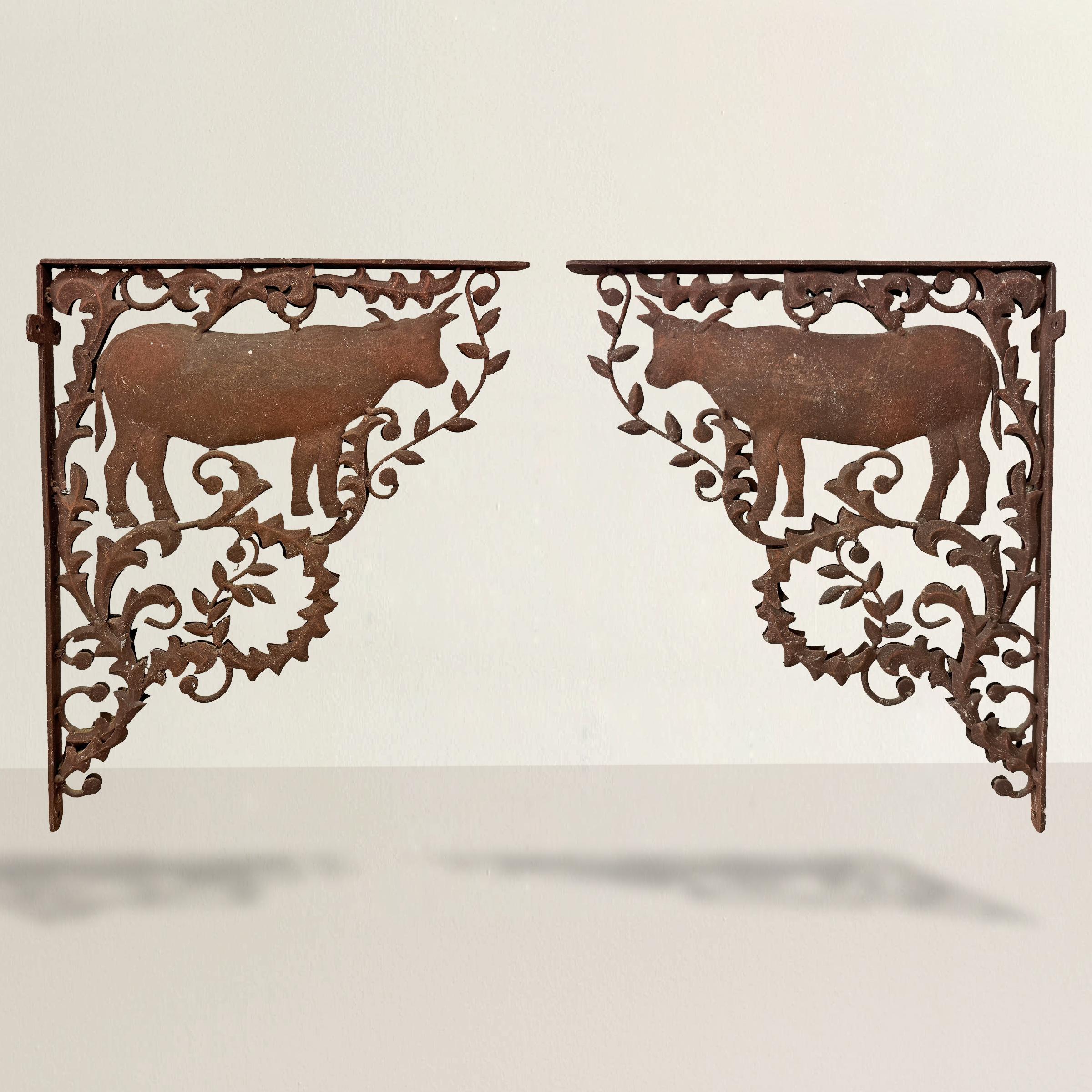 Add a touch of rustic charm to your home with these mid-20th-century American iron shelf brackets. Each bracket features the silhouette of a cow surrounded by scrolling leafy vines, exuding a classic farmhouse vibe. Perfectly scaled to support a