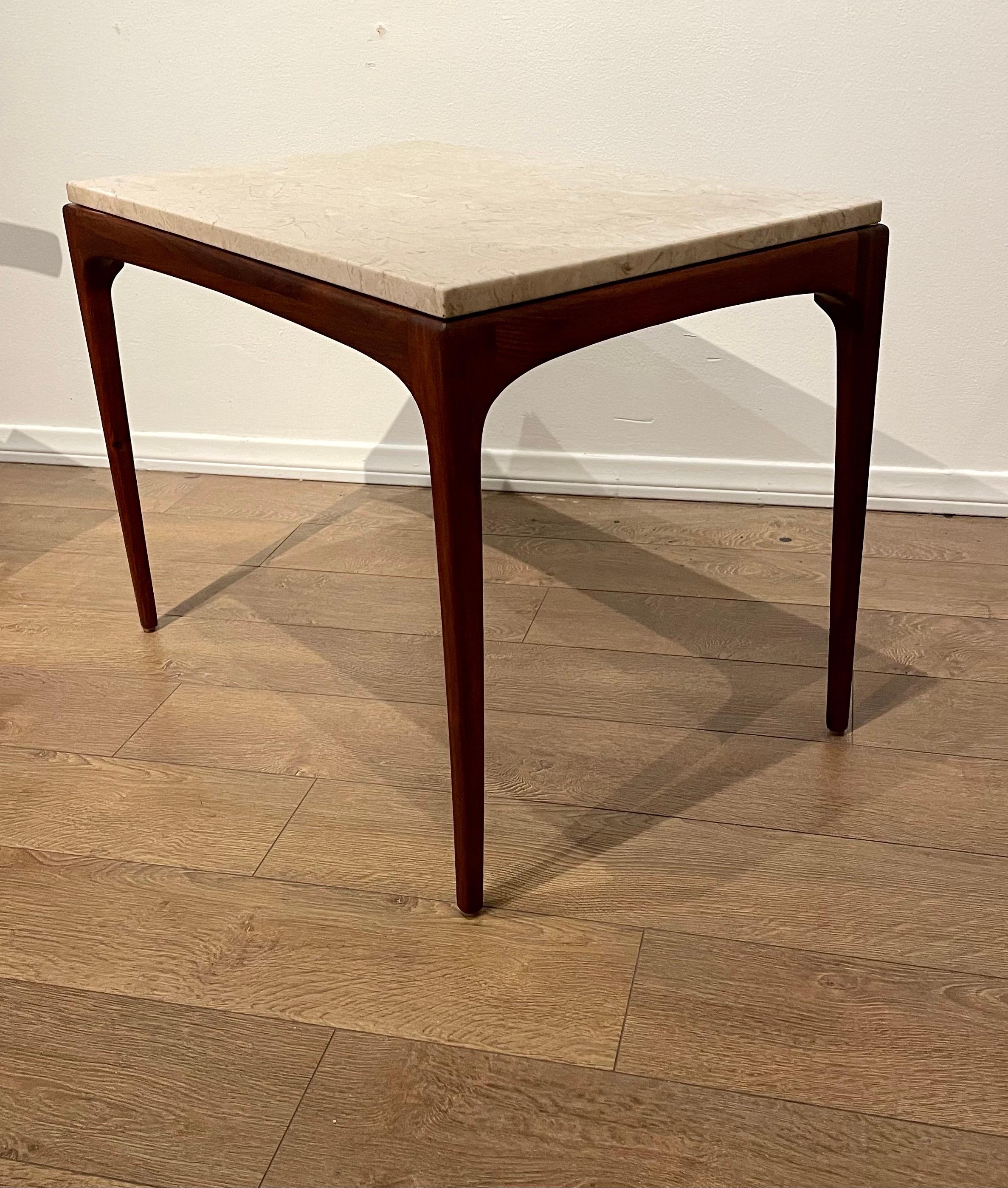 A beautiful an elegant marble and walnut end tables, circa 1960's Solid American walnut frames with Italian Carrera marble tops.