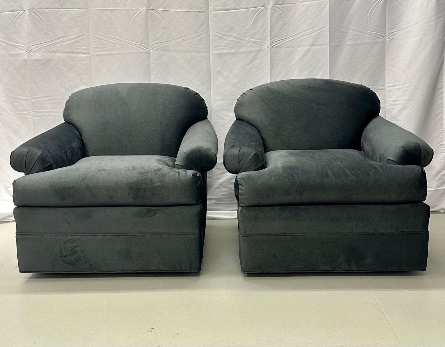 Pair of American Mid-Century Modern Style grey swivel / lounge chairs, scroll arm
Newly upholstered pair of large swivel chairs having having rolled arms. Each having a large wooden swivel base. 

 
IXXX