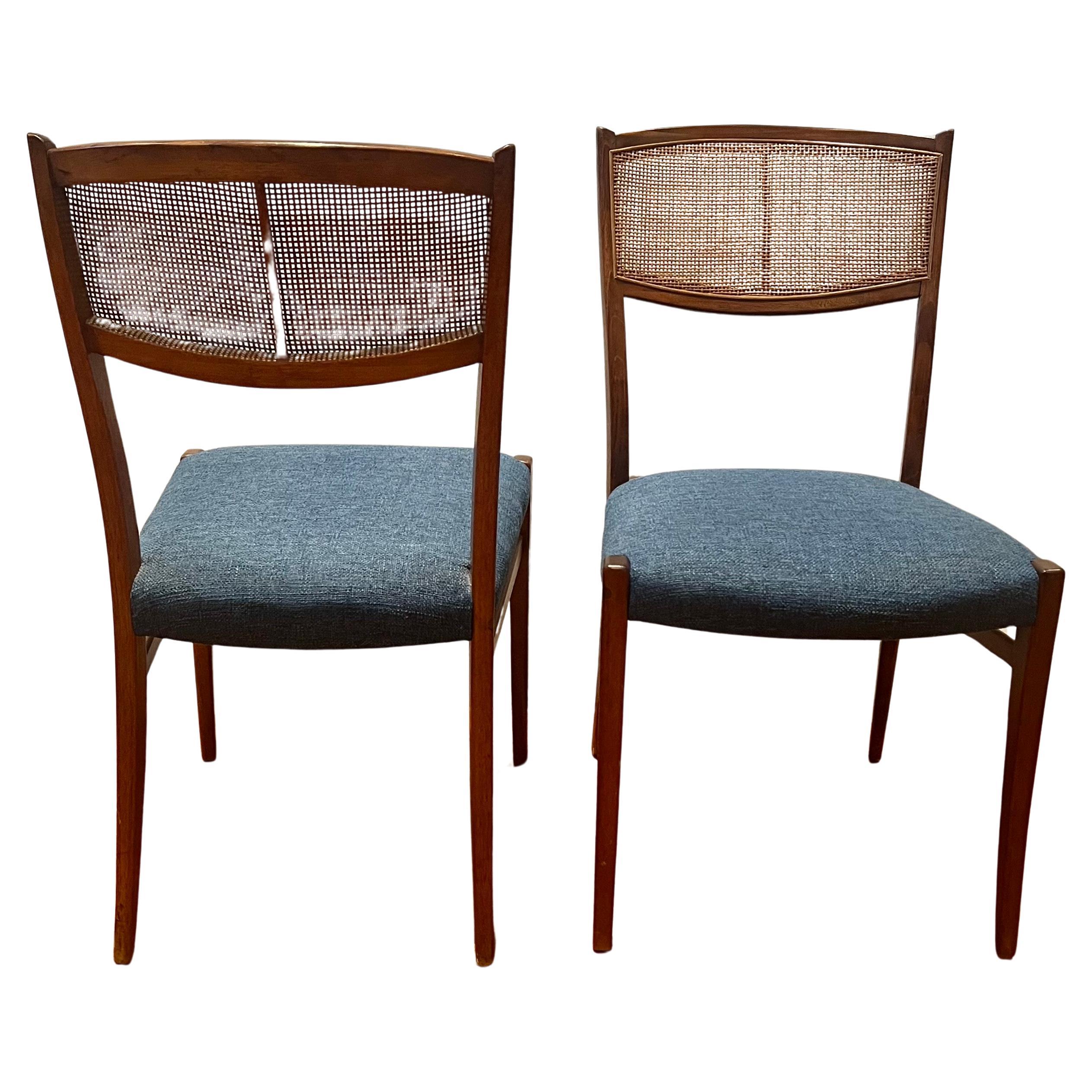 Elegant simple design pair of walnut desk dining chairs with beautiful cane backrest design all original condition , freshly upholstery with knoll fabric elegant solid and sturdy. we have 2 more available but the cane is broken we will offer the