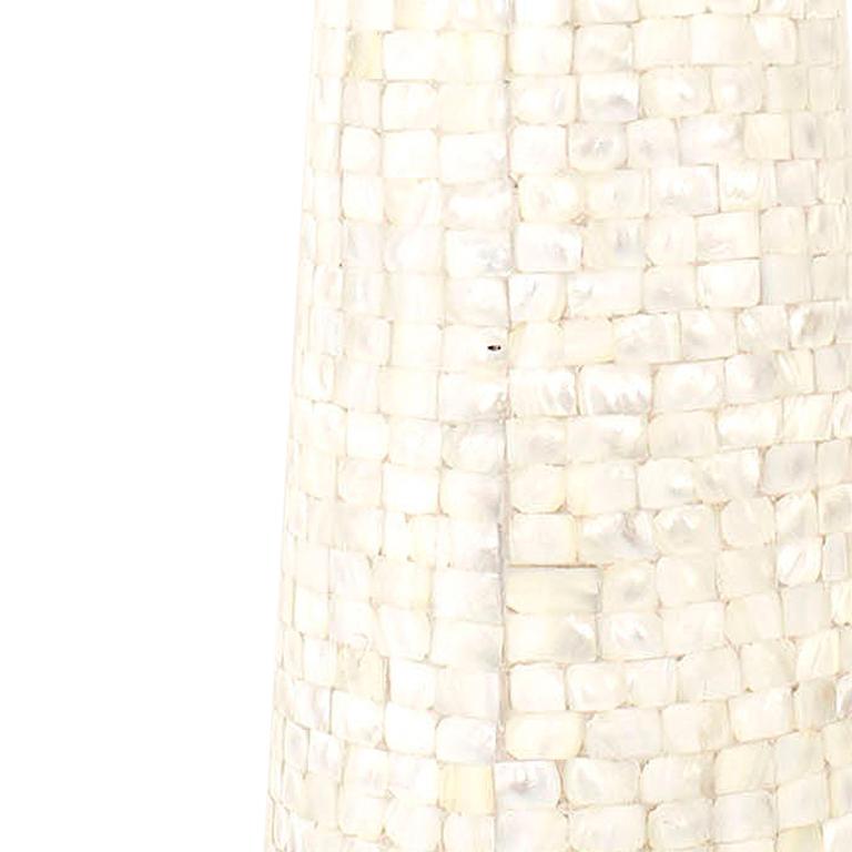 Pair of American Mid-Century tessellated table lamps with a tapered cylindrical shape resting on a round Lucite base (PRICED AS Pair).

Ships without a shade

