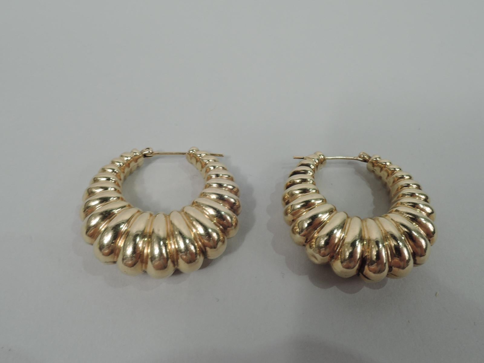 Pair of Midcentury Classical 14k gold hoop earrings with graduated lobing. United States, ca 1950. Marked. 