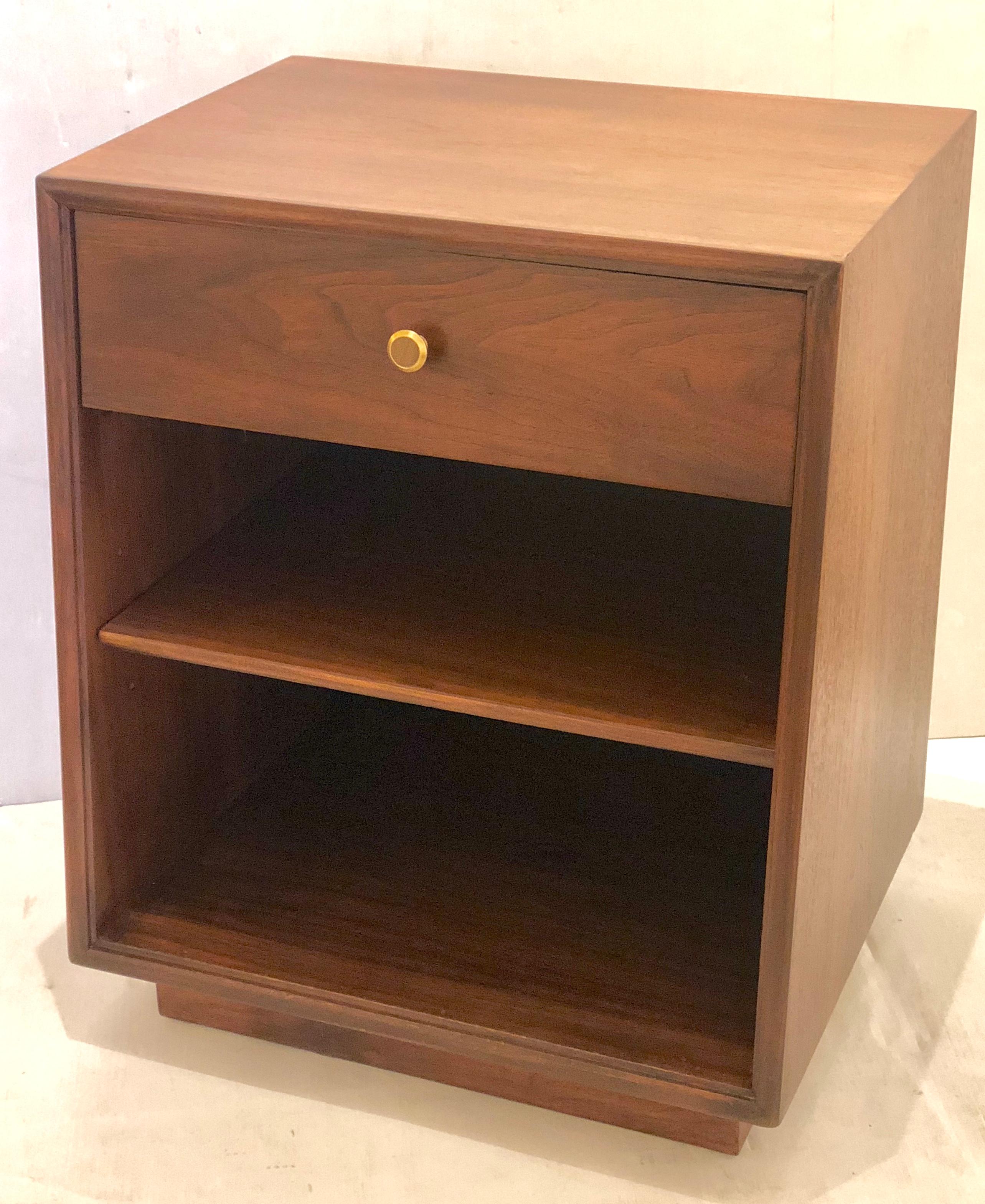 Nice pair of freshly refinished walnut nightstand by Kipp Stewart for Drexel, the set its beautiful and in great condition. With brass handles part of the Declaration line.
 