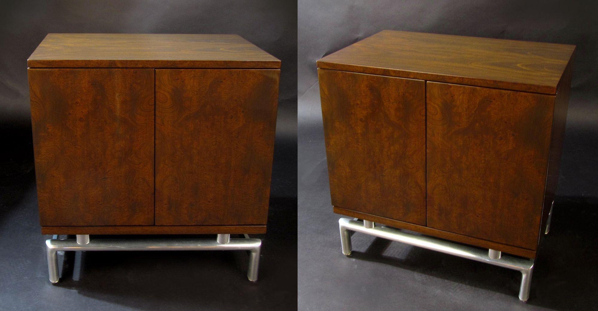 A handsome pair of fine burled wood nightstands. The cabinets sit atop chromed steel bases, giving them an illusion of floating.
Behind two front doors, each nightstand opens up to a single drawer and a large open storage area. At 25