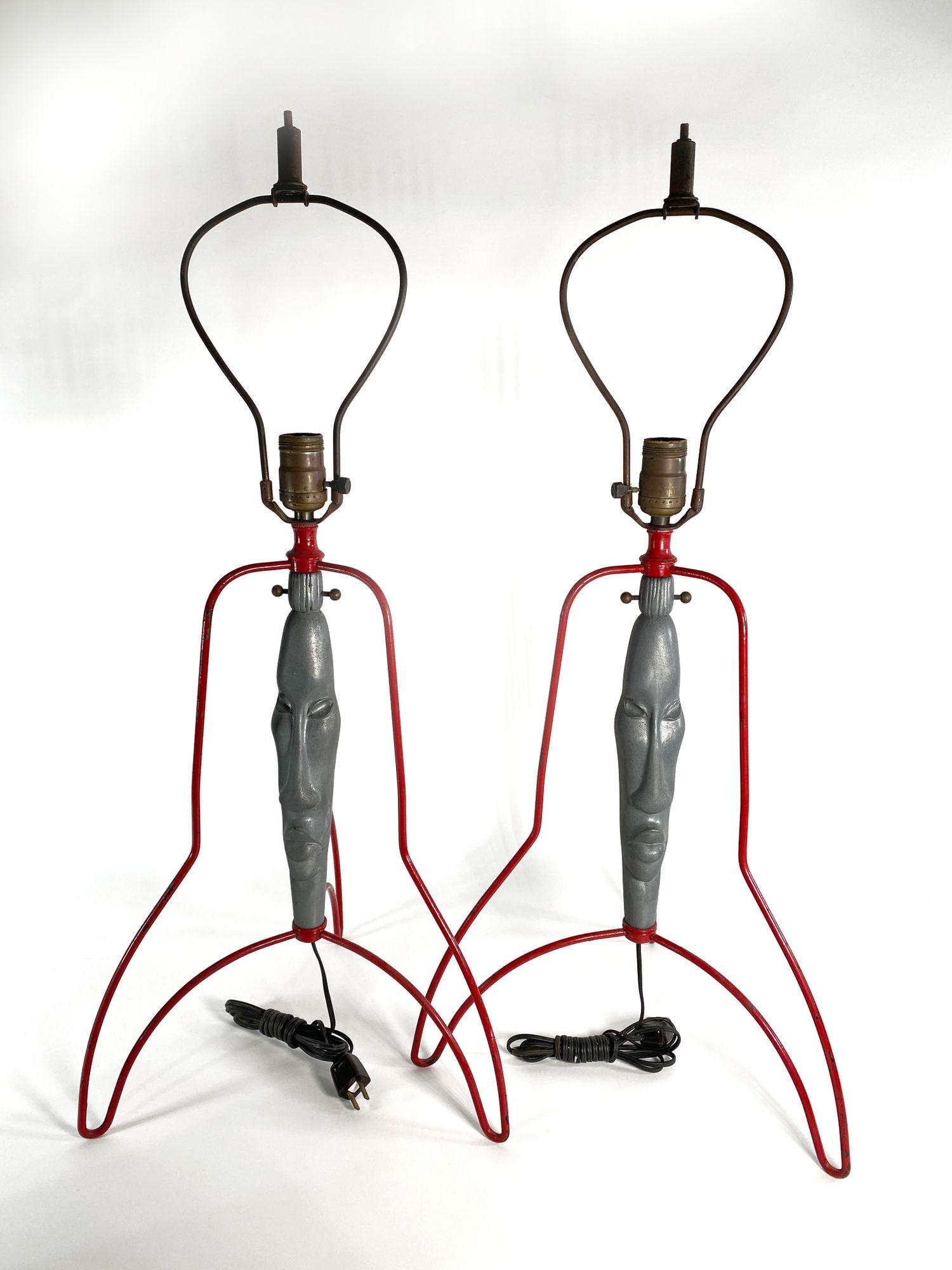 Pair of lamps. The cast faces surrounded by enameled wire supports, evocative of an atomic era spaceship. Original wiring.
Frederick Weinberg was a Philadelphia based artist (1950s) commonly known for his wire and metal sculptures and functional