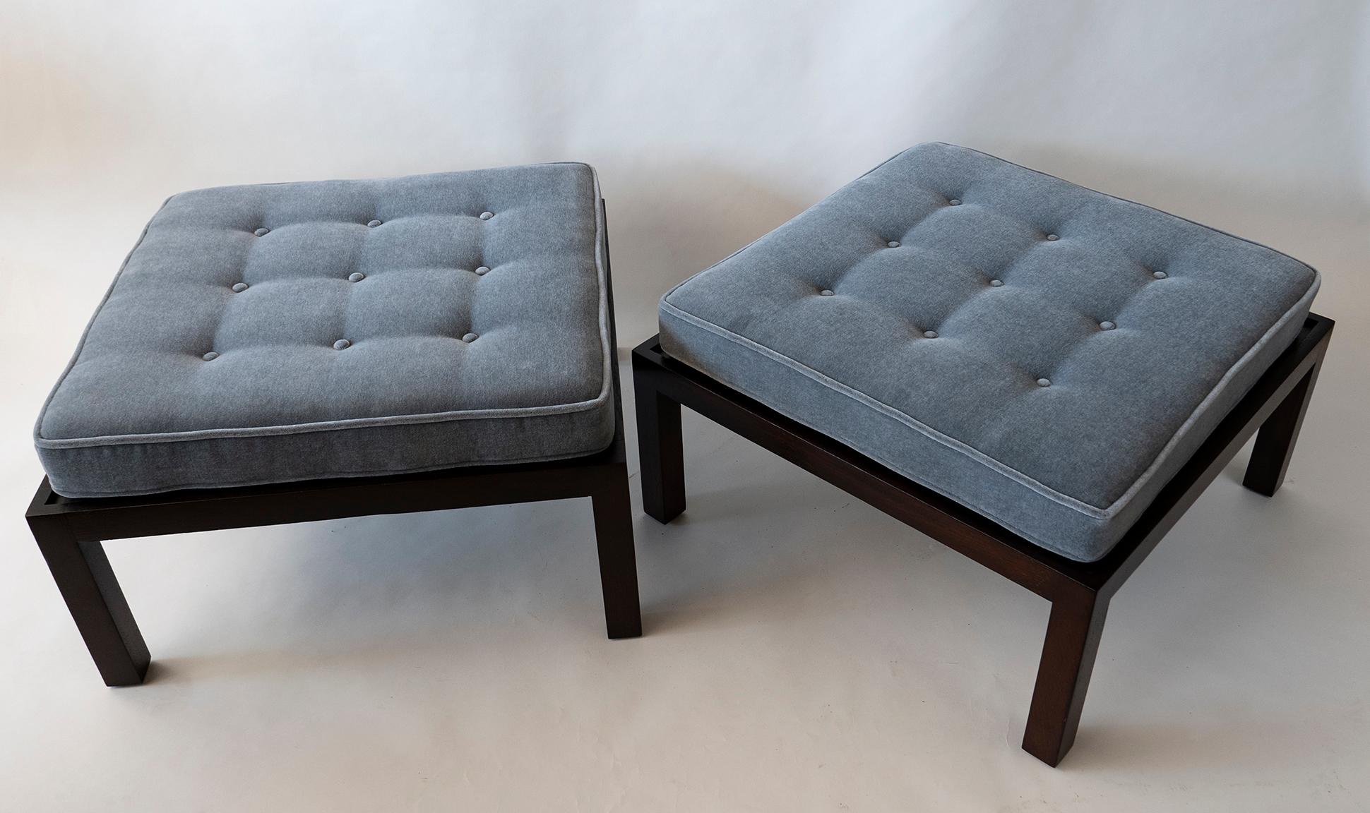 This pair is the rare oversized ottomans that wormley produced small numbers.