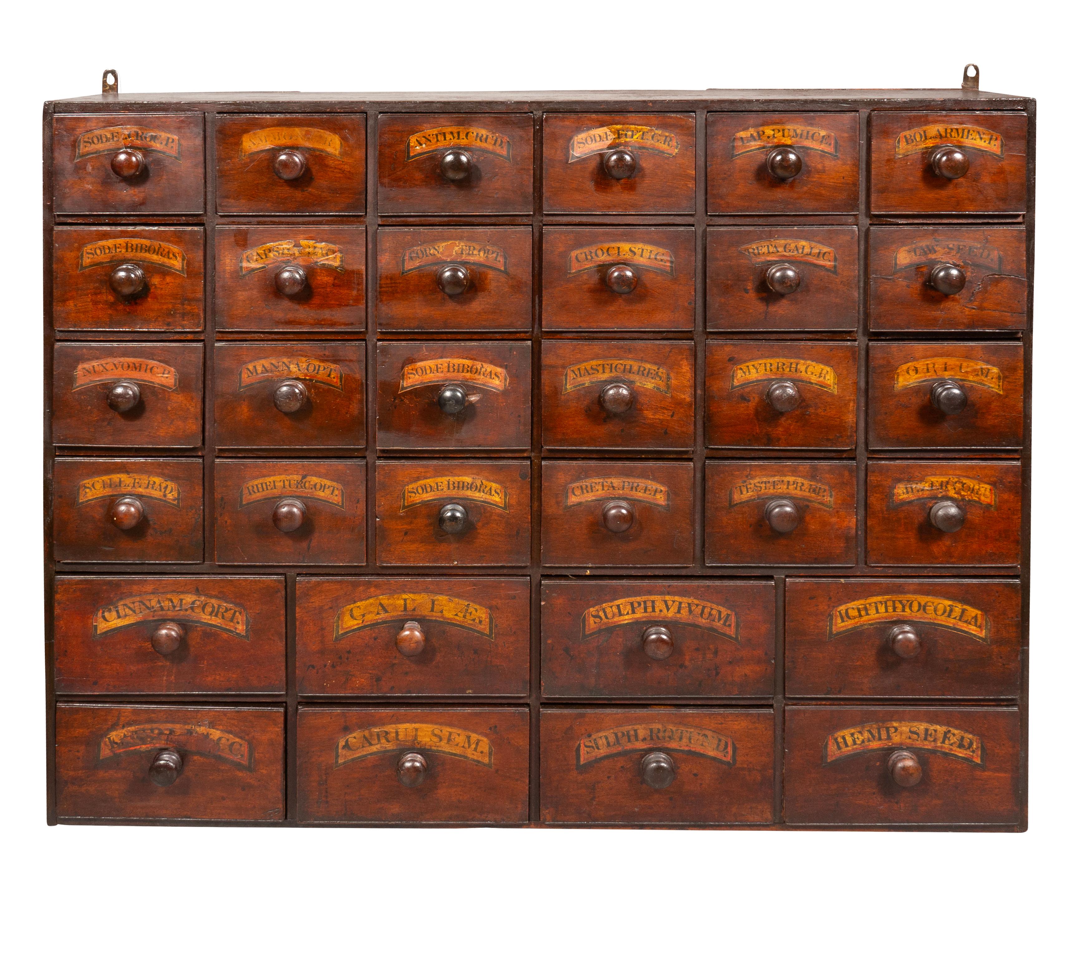 Each rectangular with multiple drawers with wood knobs and paper labels. From the estate of the founder of Yankee Candle Company.