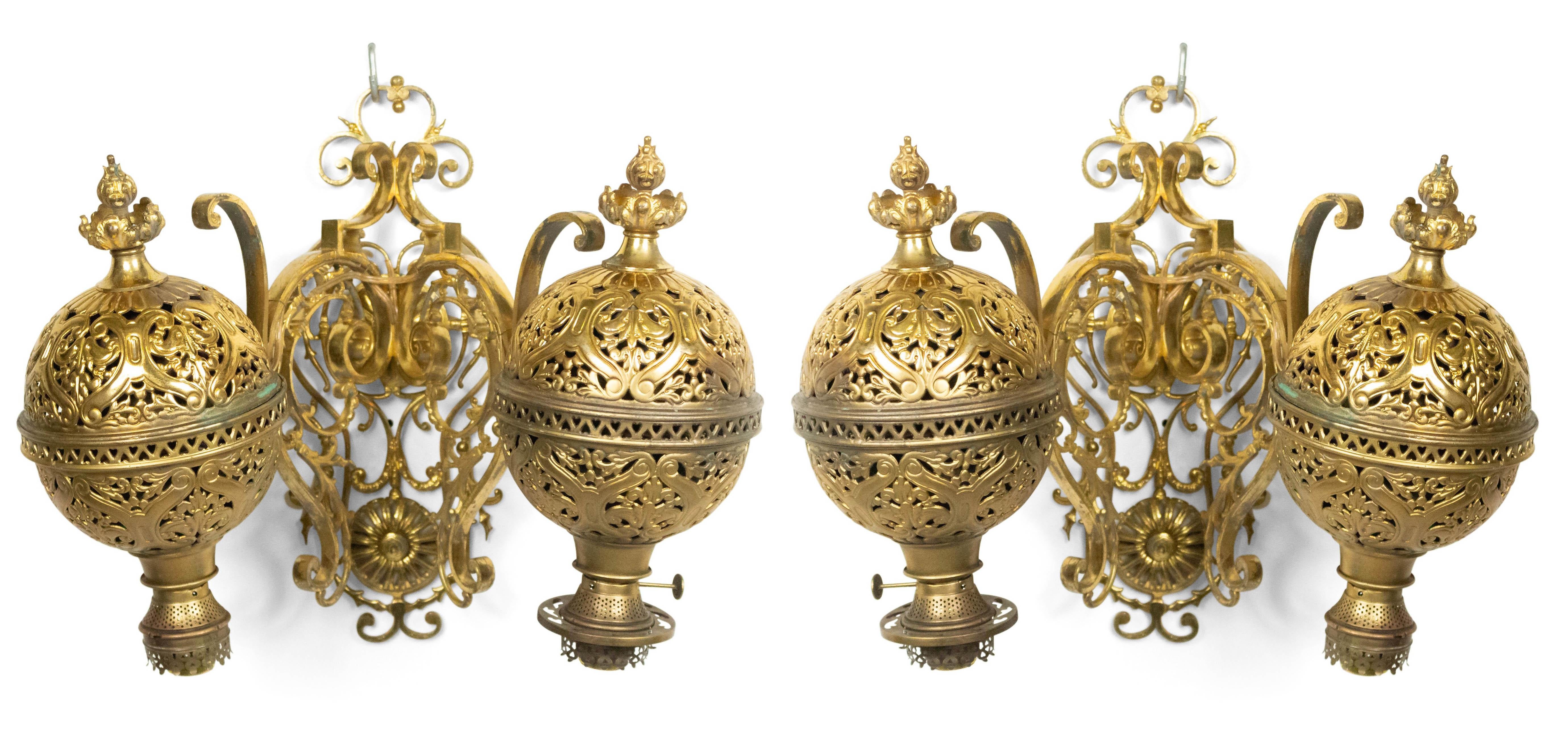 Pair of American Victorian brass oil lamp wall sconces with a filigree design and two scroll arms holding large filigree balls. (PRICED AS Pair)
