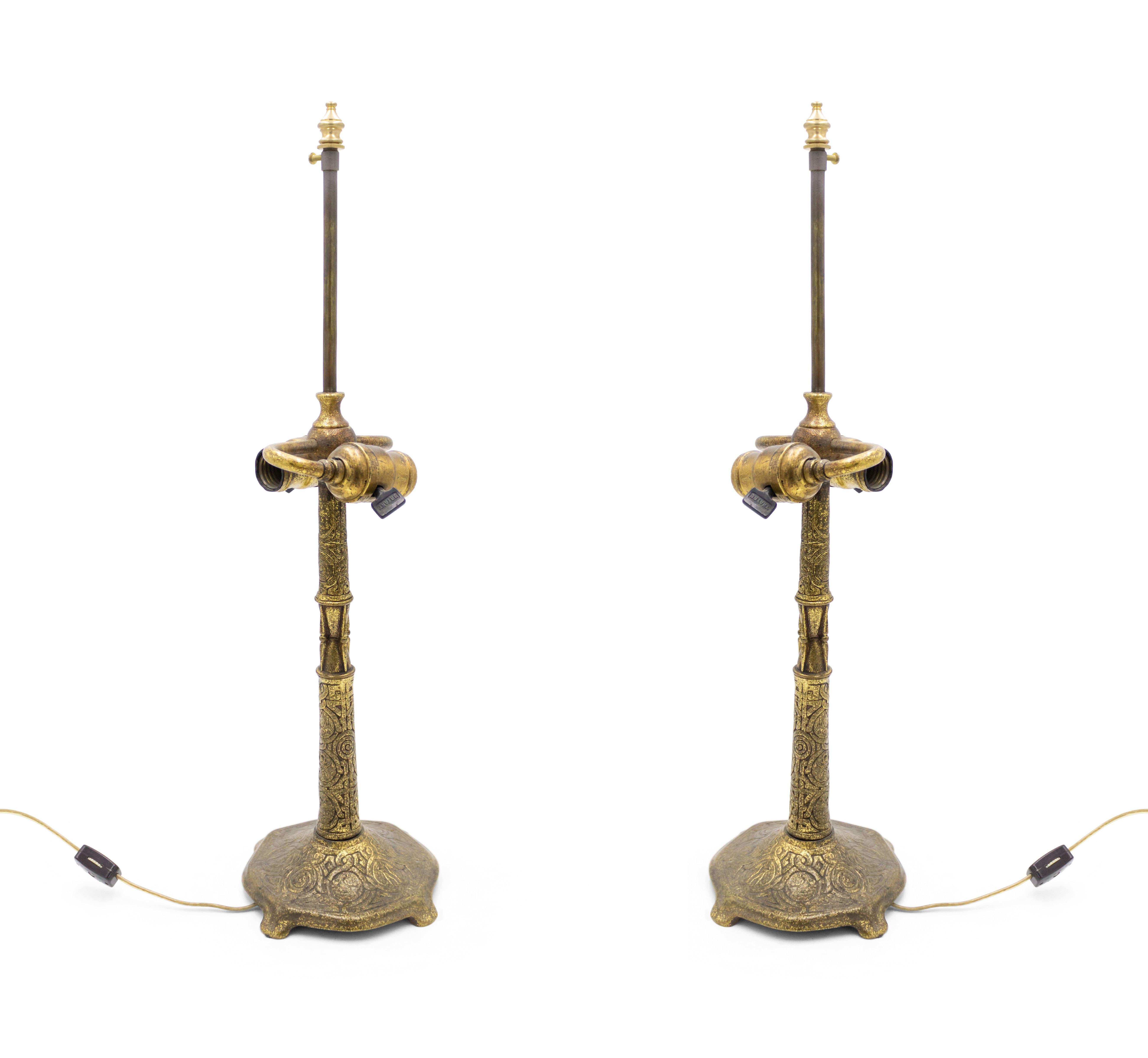 Pair of American Victorian bronze dore table lamps (signed: TIFFANY) (PRICED AS Pair).
