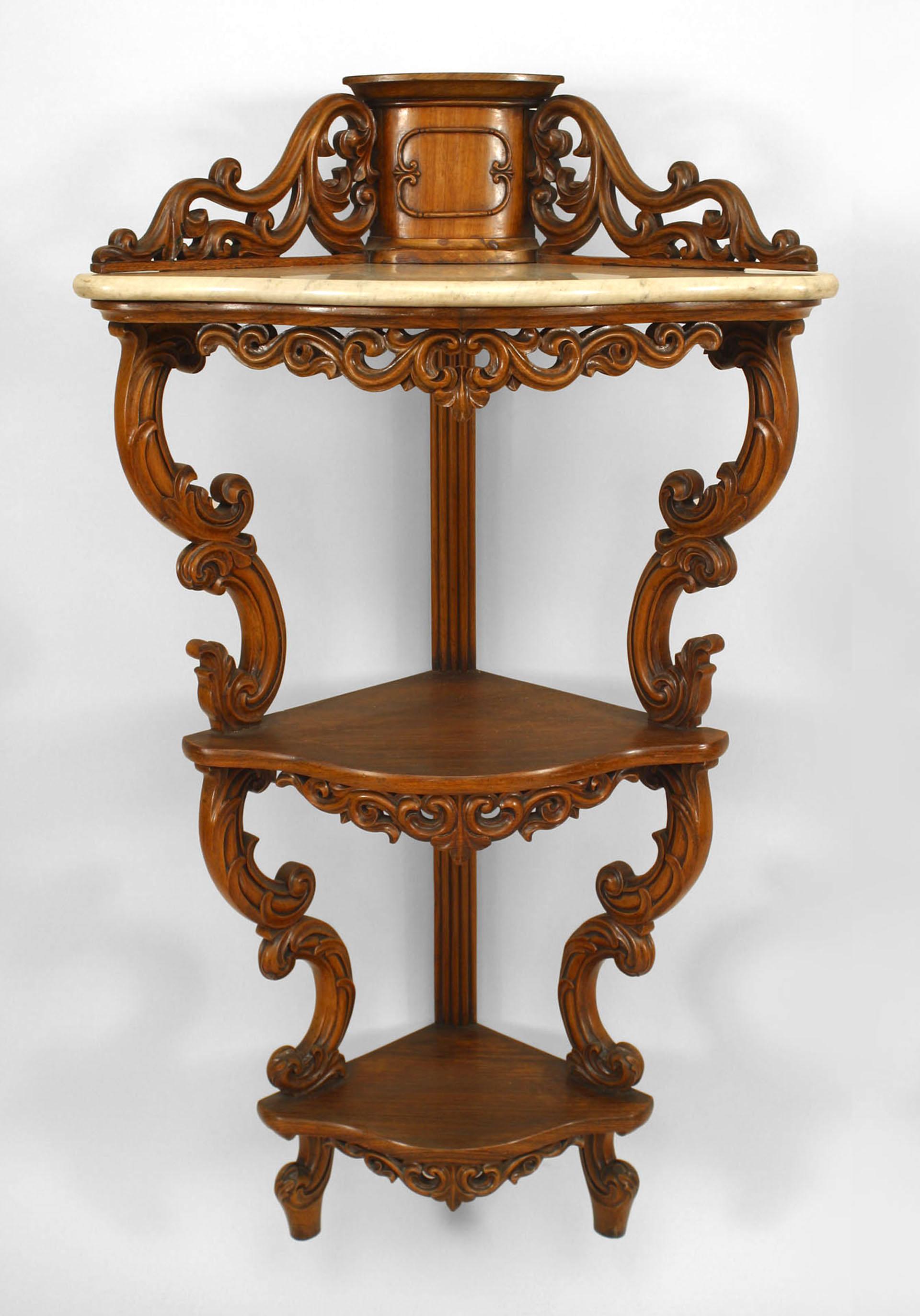 Pair of American Victorian rosewood 3 tier corner hanging etagere cabinets with white marble top shelf and filigree carved trim. (PRICED AS Pair)
