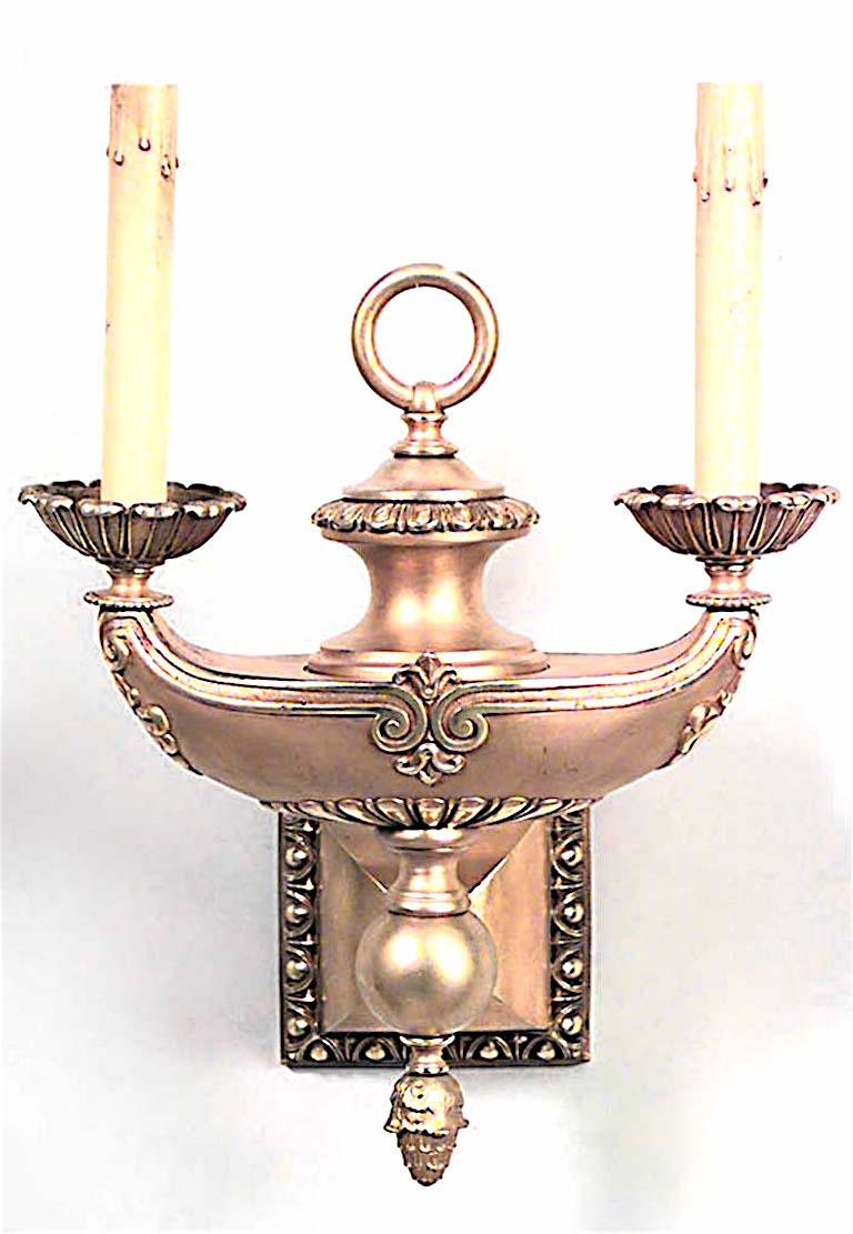 Pair of American Victorian gilt bronze wall sconces with two arms, and Aladdin lamp design, finial bottoms, and ring tops. (PRICED AS Pair)
