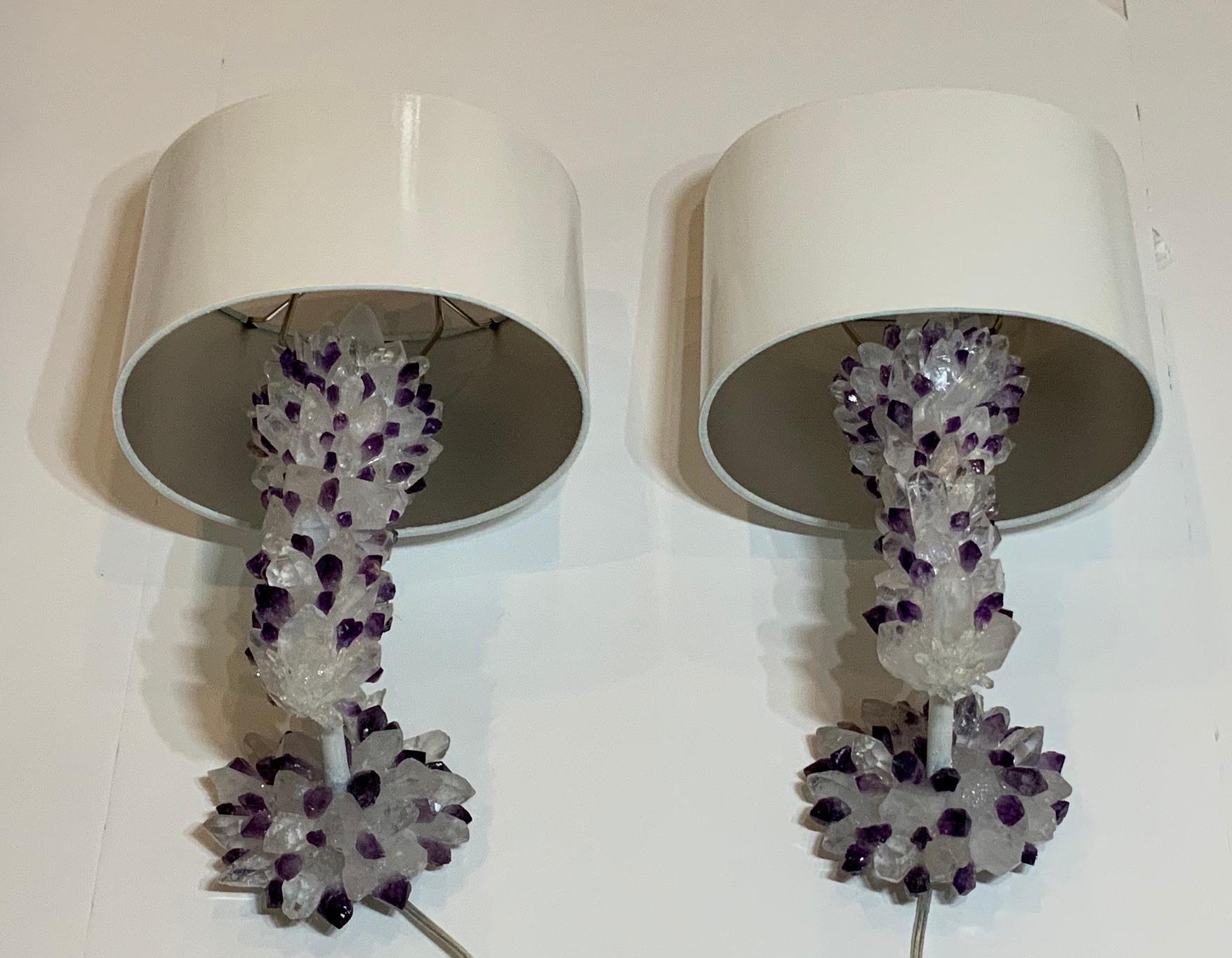 Exceptional pair of wall sconces artistically made of small real amethyst stone embedded together with white and clear crystal point
To made a beautiful one of a kind wall sconces, includes two custom
Made shades and two amethyst top