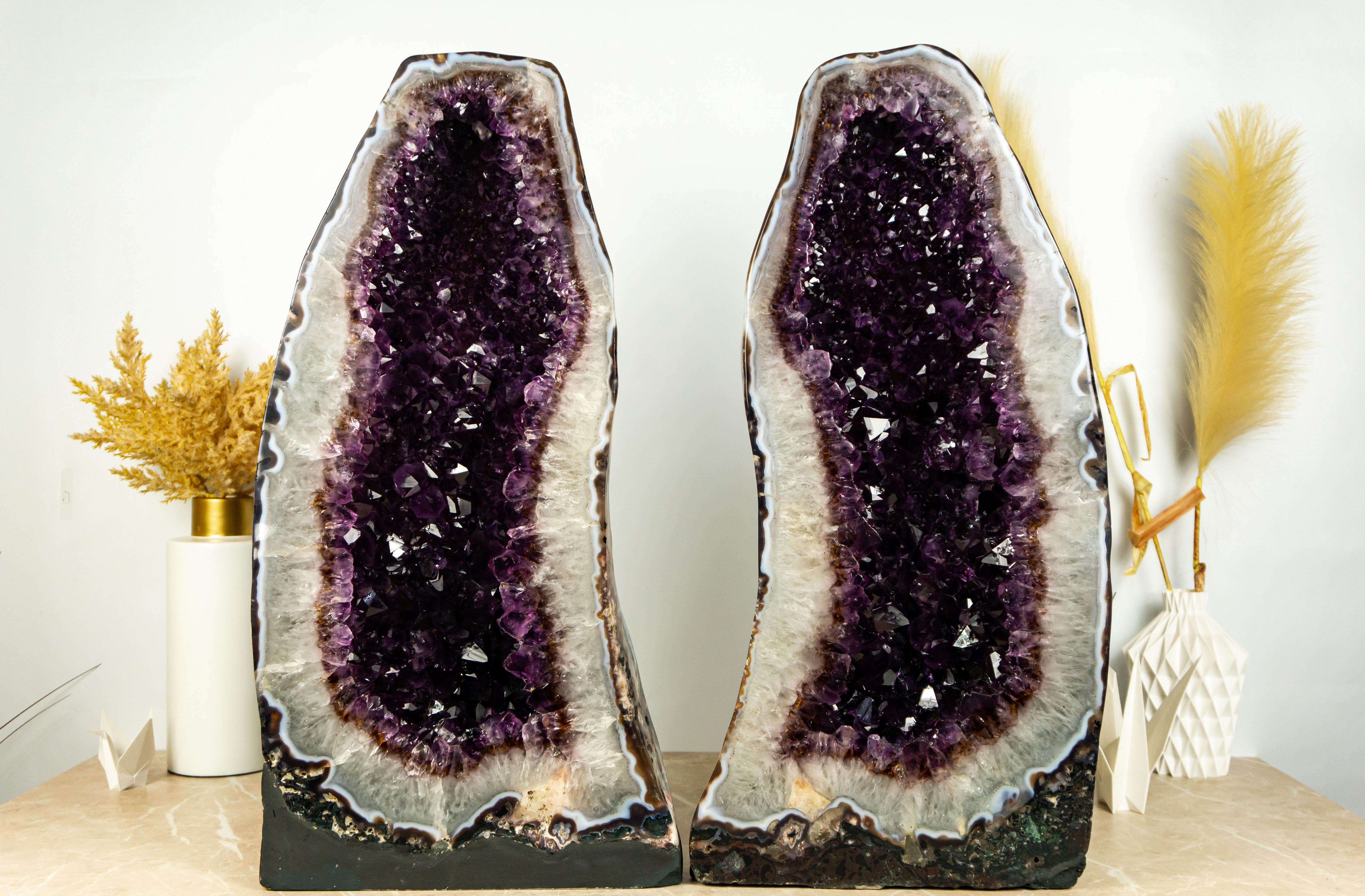 Rare in many ways, this pair of Amethyst geodes bring an aesthetically pleasing formation with its purple amethyst crystals beautifully contrasting against the white quartz, creating a stunning beauty that is further enhanced by the spread of golden