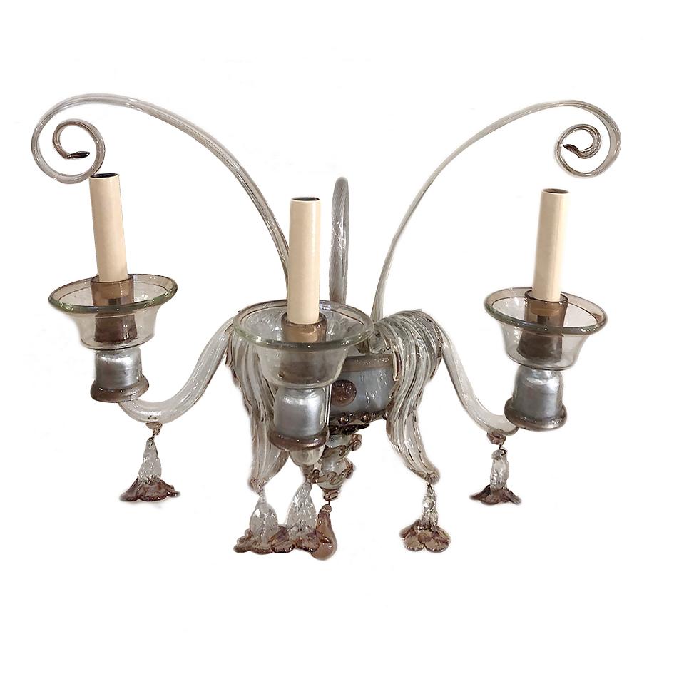 A pair of circa 1920's three-arm Venetian glass sconces with clear with amethyst hues in the glass.

Measurements:
Height: 18