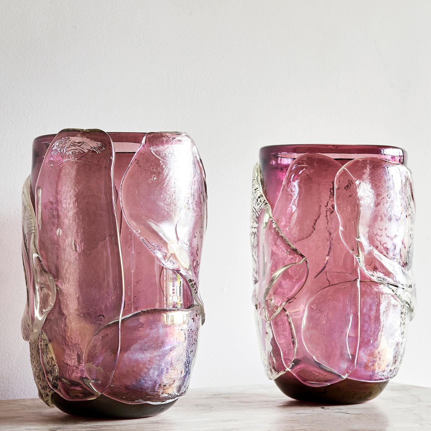 A lilac, vintage pair of Mid-Century Modern Italian hand blown Murano glass vases “Vetro Artistico di Murano” with clear amethyst and grey colored paneled design, in good condition. Wear consistent with age and use, circa 1960, Italy.

Measure: