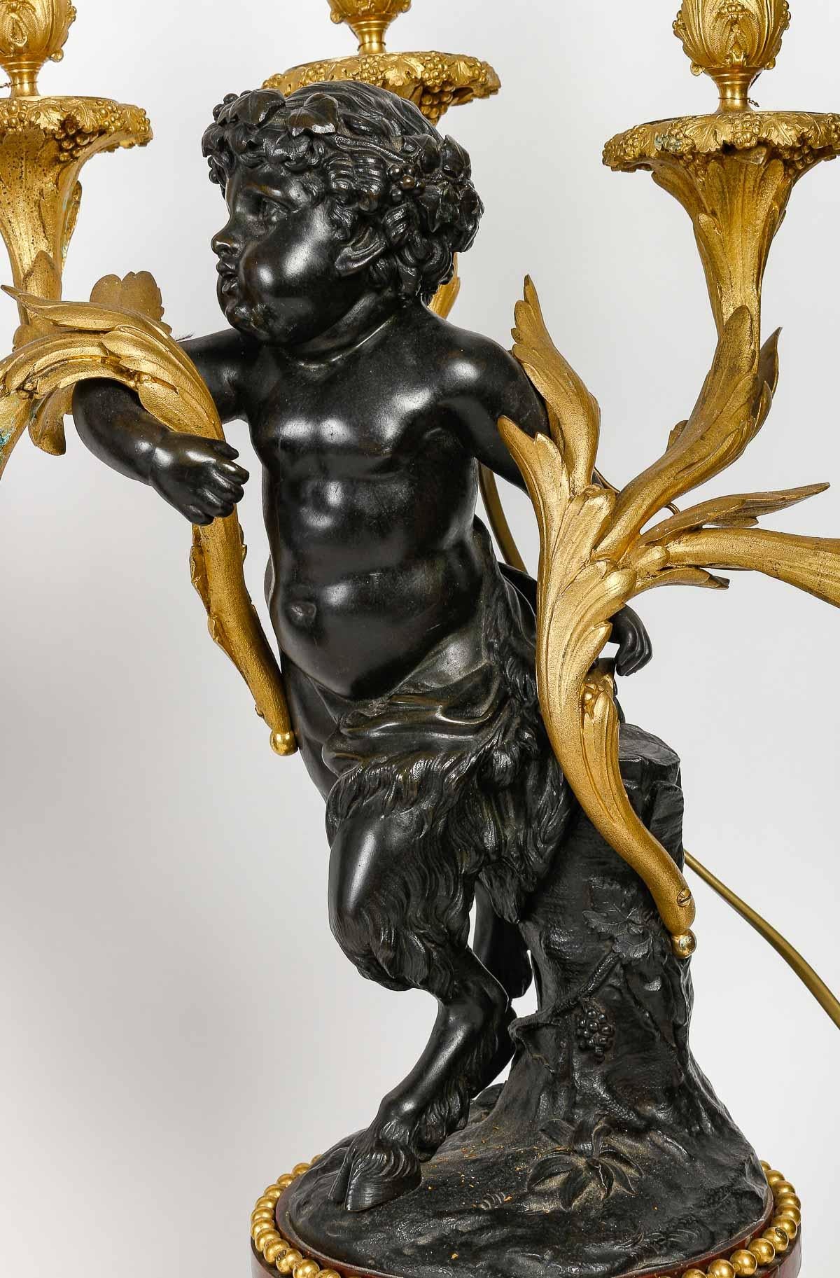 Pair of Amours Candelabra, Grande décoration, Gilt bronze, Antique bronze. 1