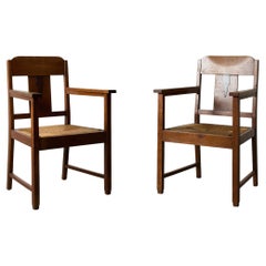 Paire de chaises à accoudoirs en chêne et jonc de l'école d'Amsterdam