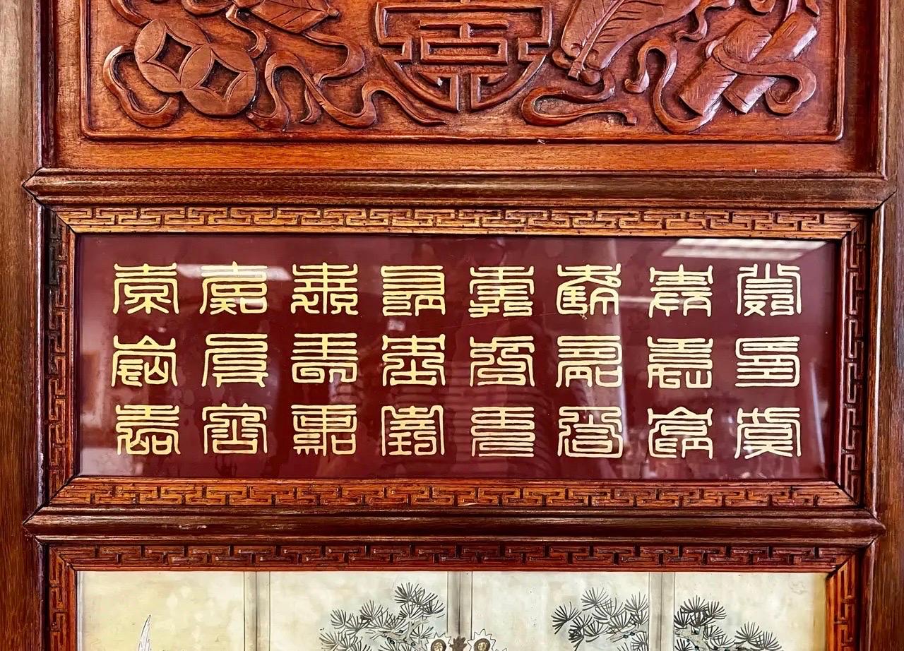 Beautiful paintings displayed in intricately carved wood frames.  Each painting is done on silk, showcasing the regal attire and grandeur of imperial China.  These are statement pieces that measure 63