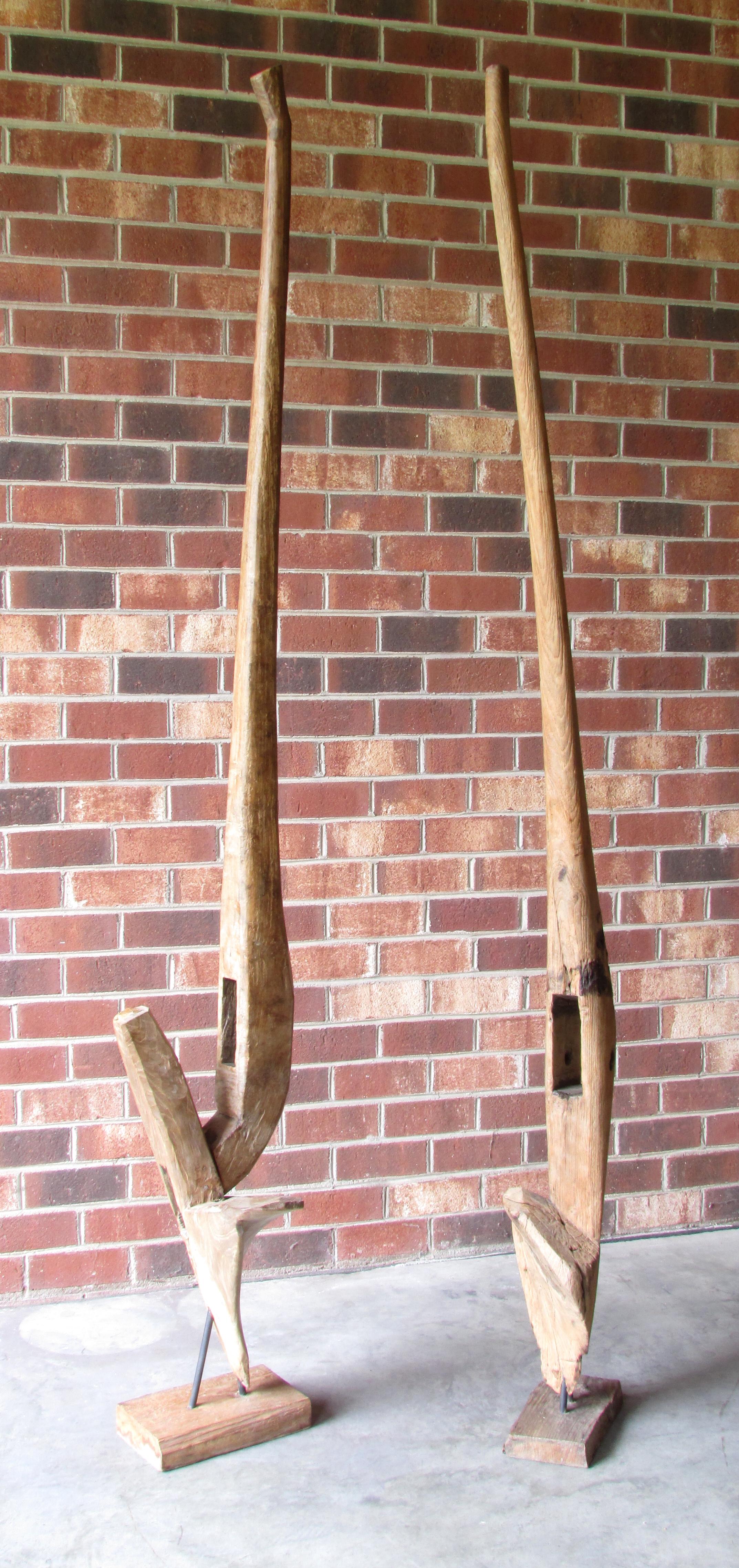 Pair of Ancient Wooden Farm Implements Mounted as Sculpture In Distressed Condition For Sale In High Point, NC