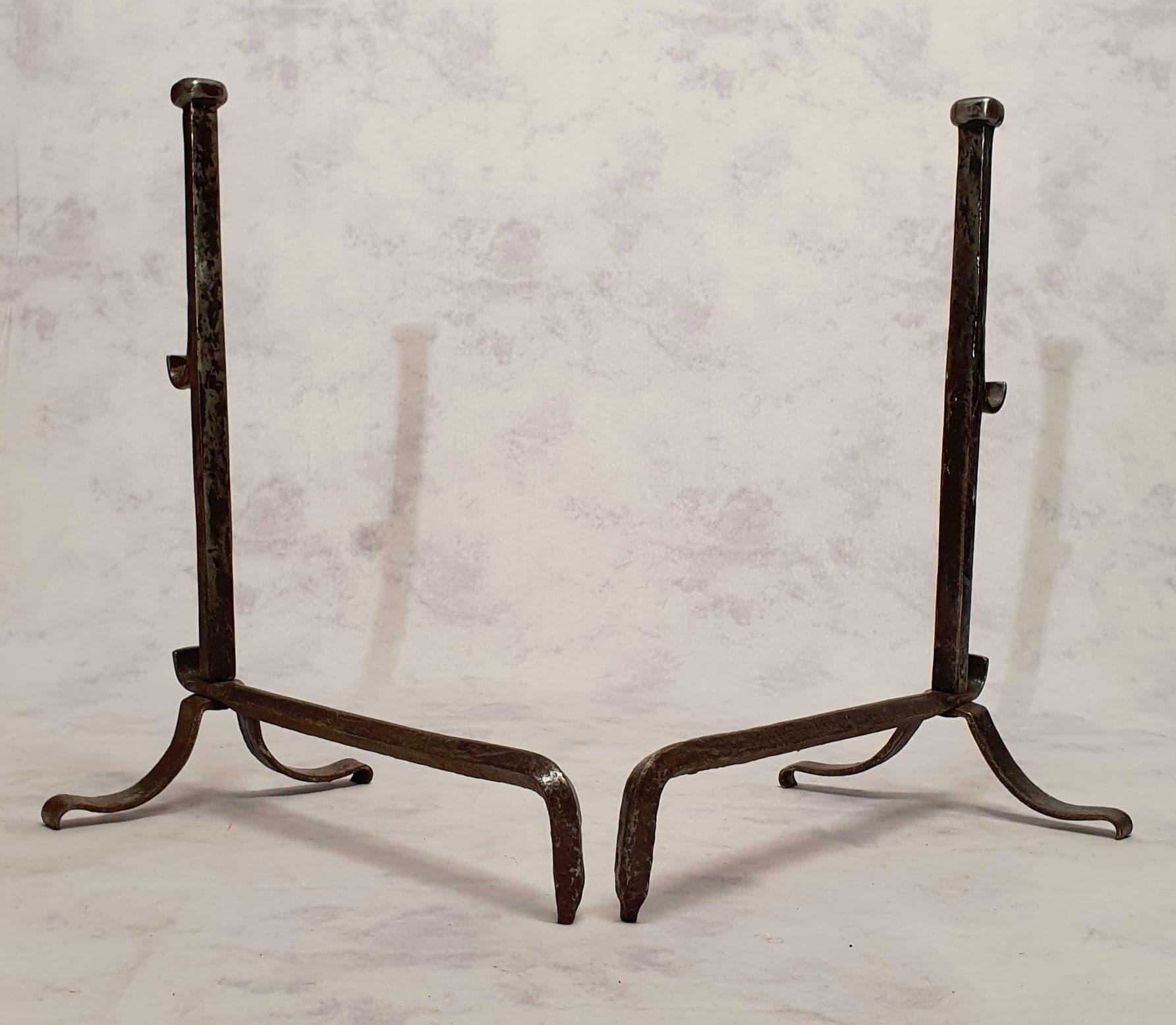 Pair of Louis XIII style wrought iron andirons. 19th century work. These typically Louis XIII andirons are sober in shape and have an exceptional patina.

   