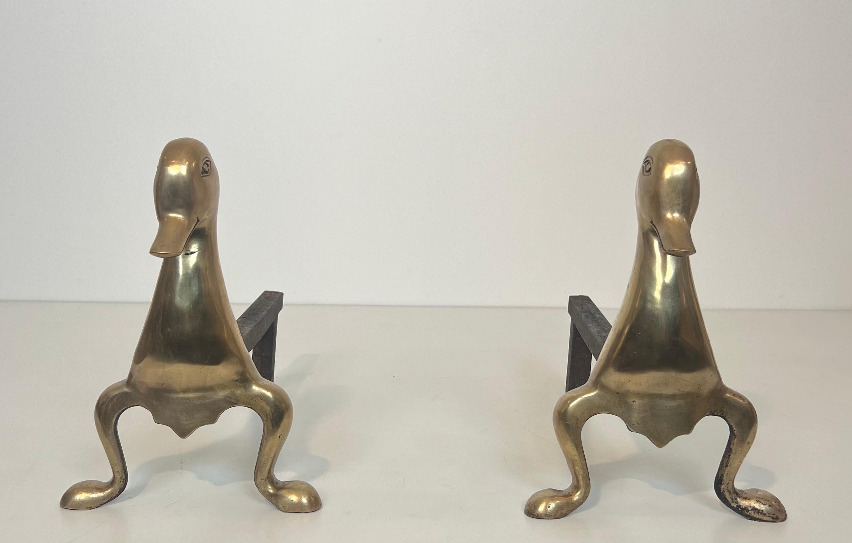This very nice and unusual pair of andirons represents stylized ducks in brass. This is a French work in the tyle of Claude and François-Xavier Lalanne. Circa 1970