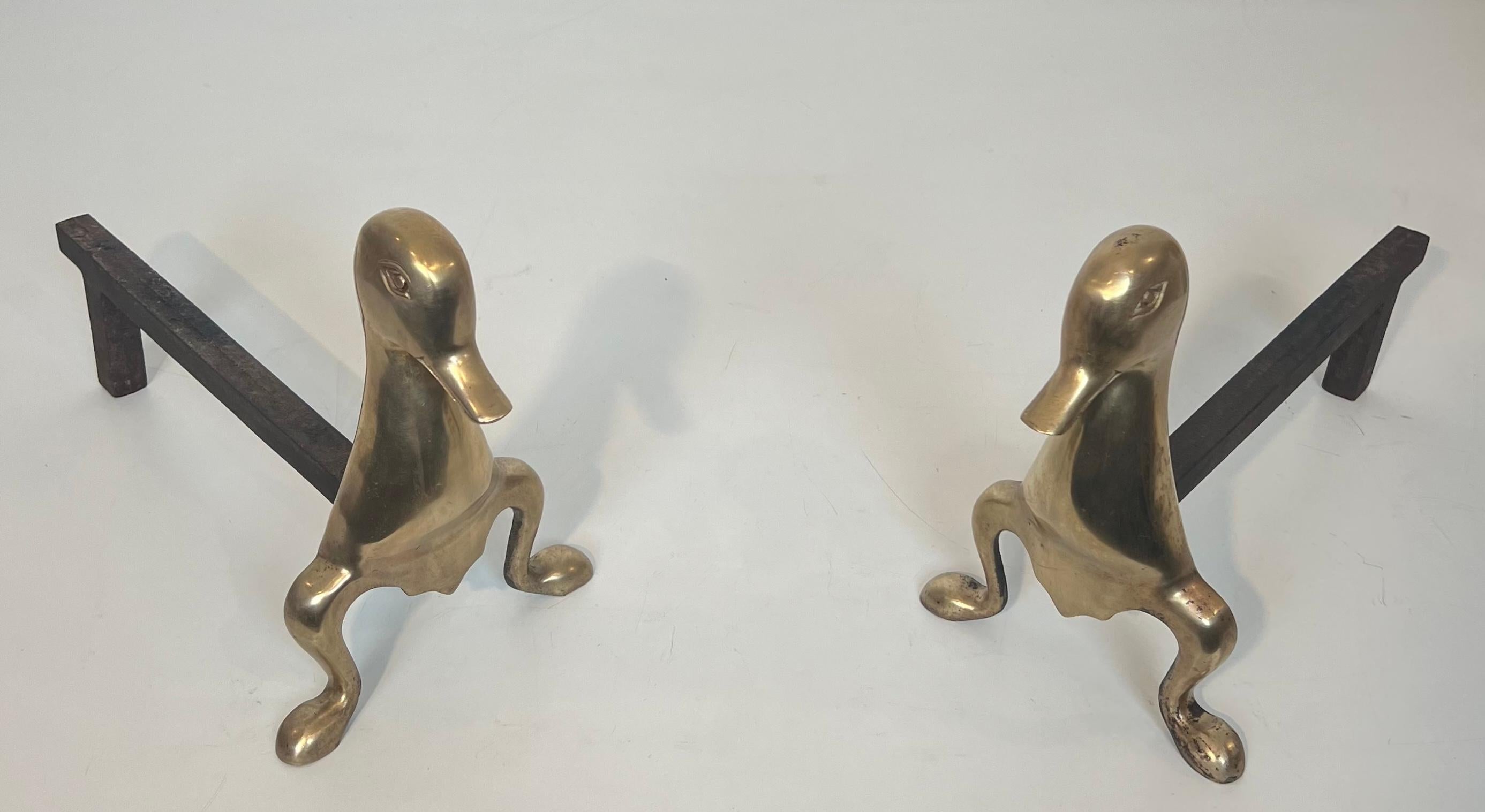 Mid-Century Modern Pair of Andirons Representing Stylized Ducks in Brass In the Taste of Claude and For Sale