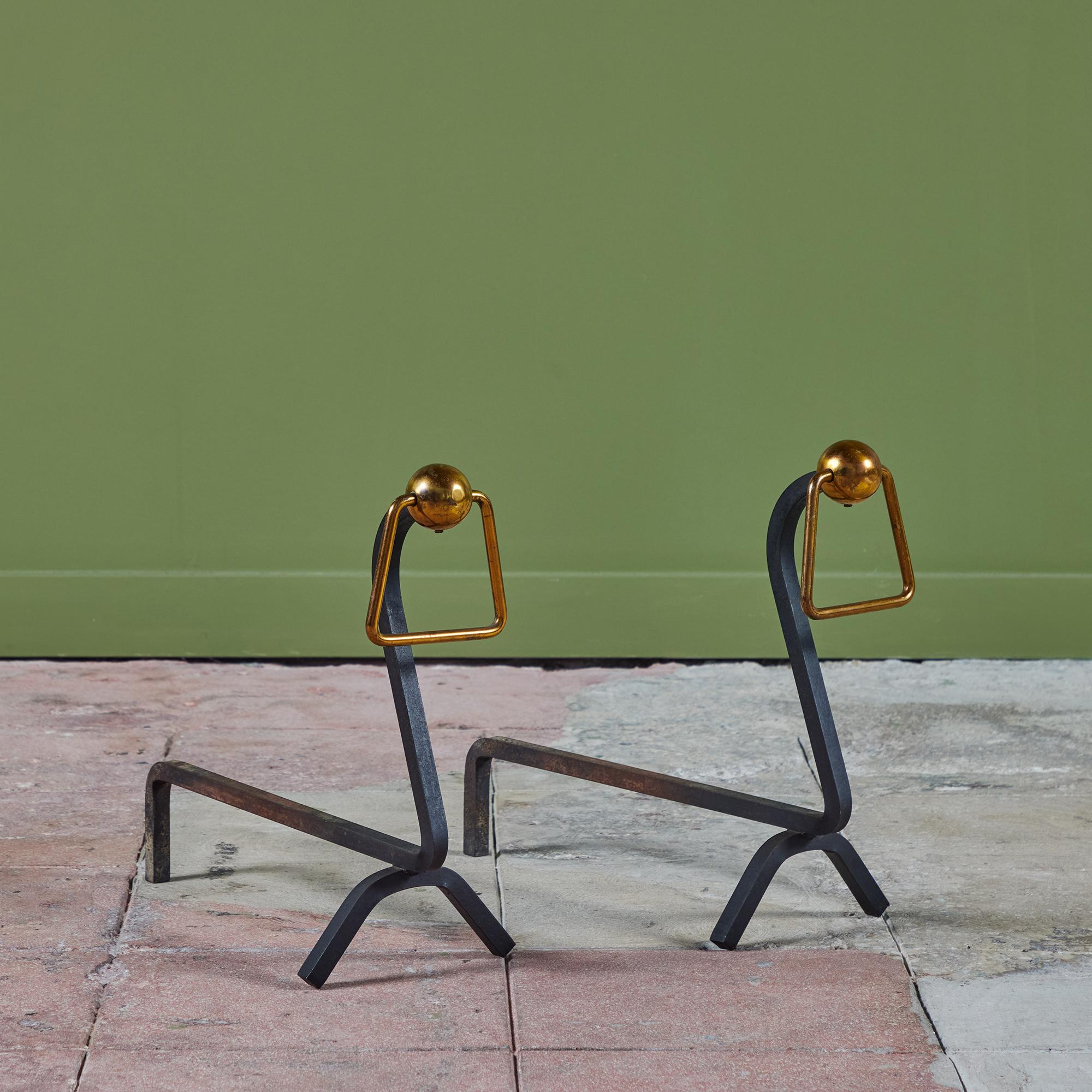 These modernist andirons feature a curved front facing wrought iron bar topped with a brass sphere and square ring. A perfect compliment to your home fireplace.

Dimensions
6” width x 16.5” depth x 12” height.

Condition
Good vintage condition with