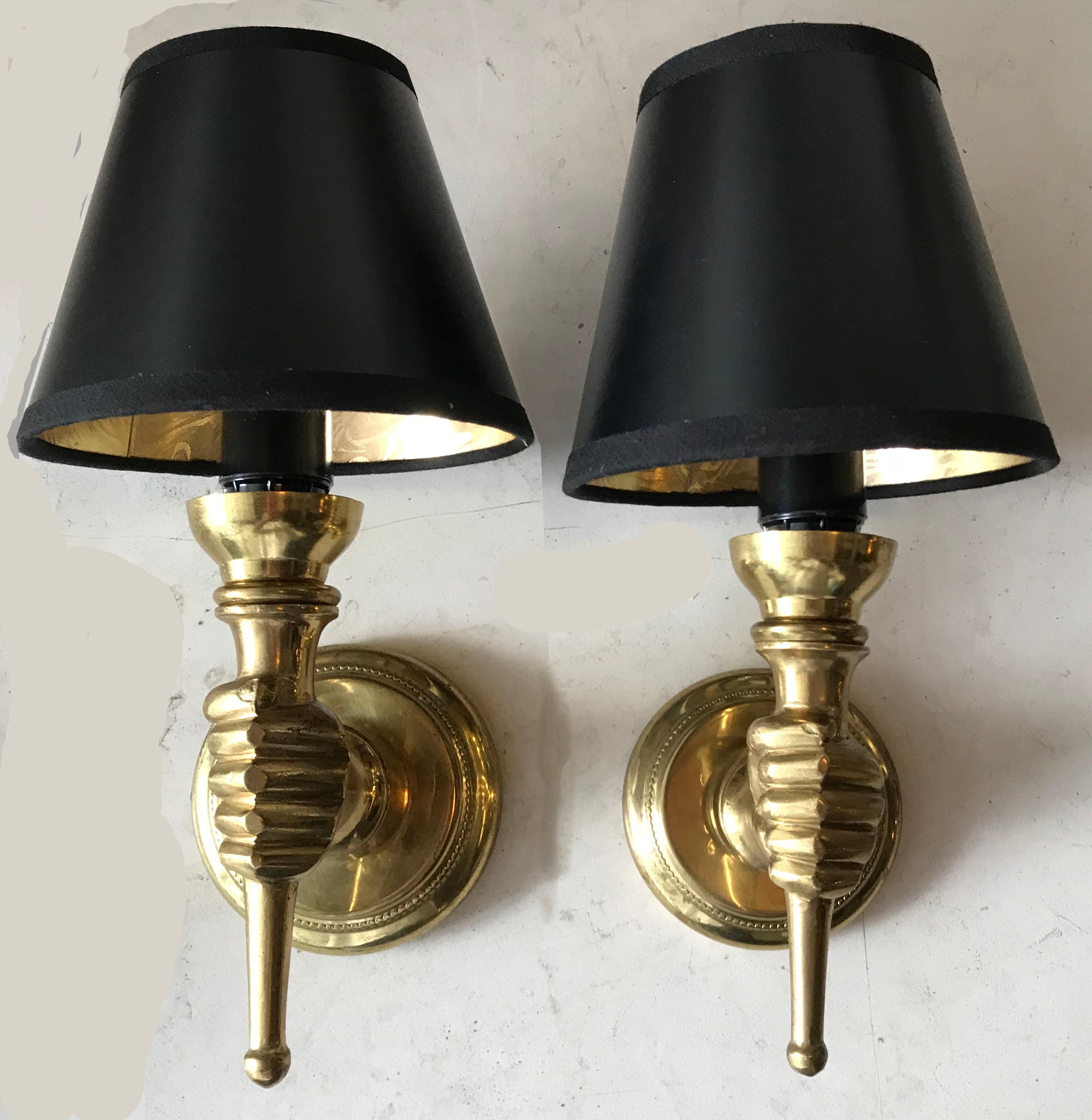Pair of French sconces figuring hands holding a torche†André Arbus style. Coming from an hotel in Paris 2 pairs available, priced by pair. US rewired and in working condition. One light per sconce, 60 watts max. Backplate diameter 3 inches.
US