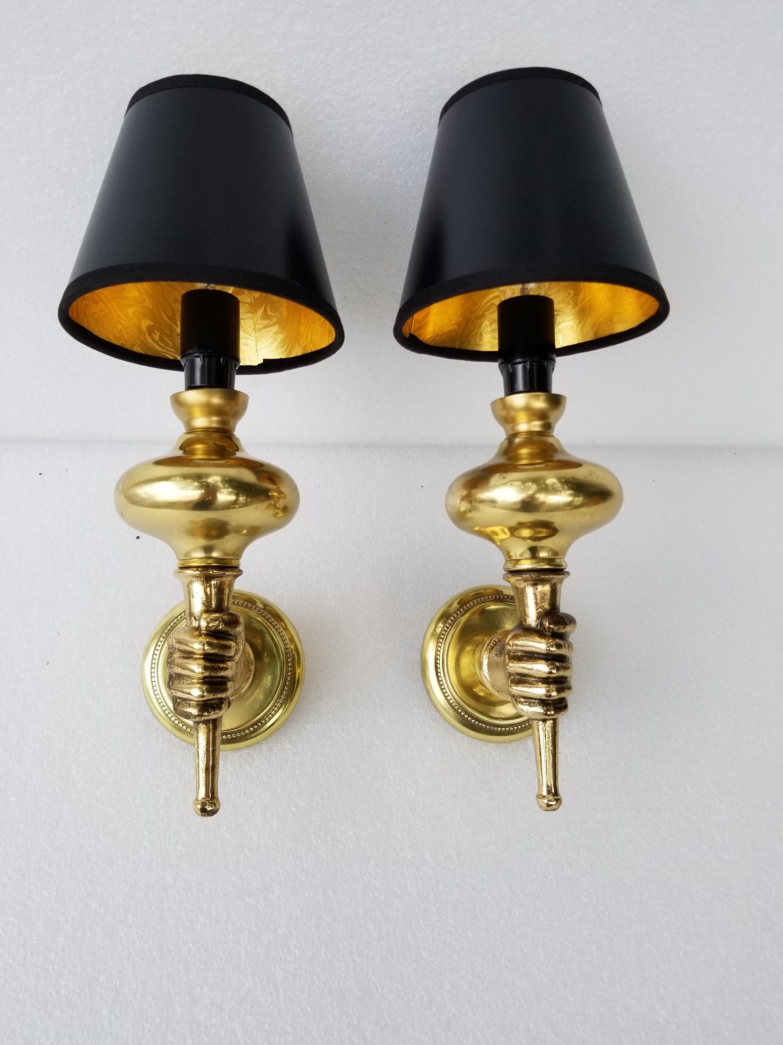 Pair of Andre Arbus style sconces figuring a hand holding a lighted sphere
40 watts Max Bulb.
US rewired and in working condition.
 