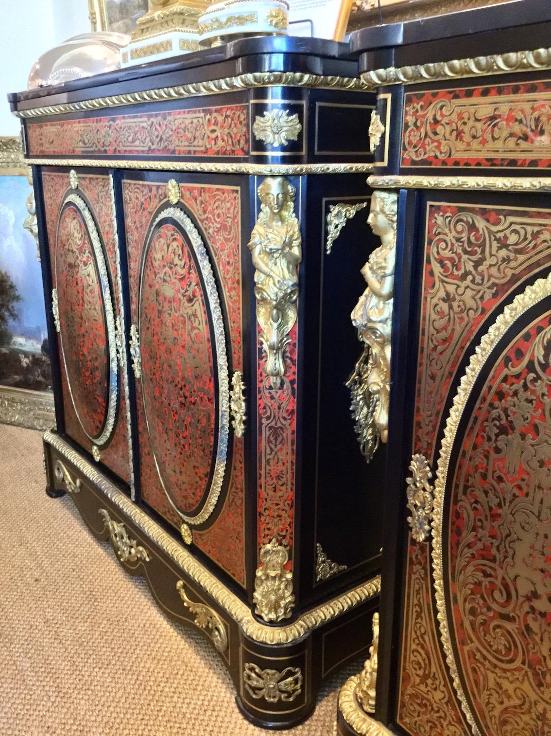 A pair of André-Charles Boulle (style) cabinets, circa 1860-1870

A pair of cabinets in the style of André-Charles Boulle. They are of mahogany with tortoiseshell (turtleshell) marquetry and beautifully applied gilt bronze ormolu mounts, handles