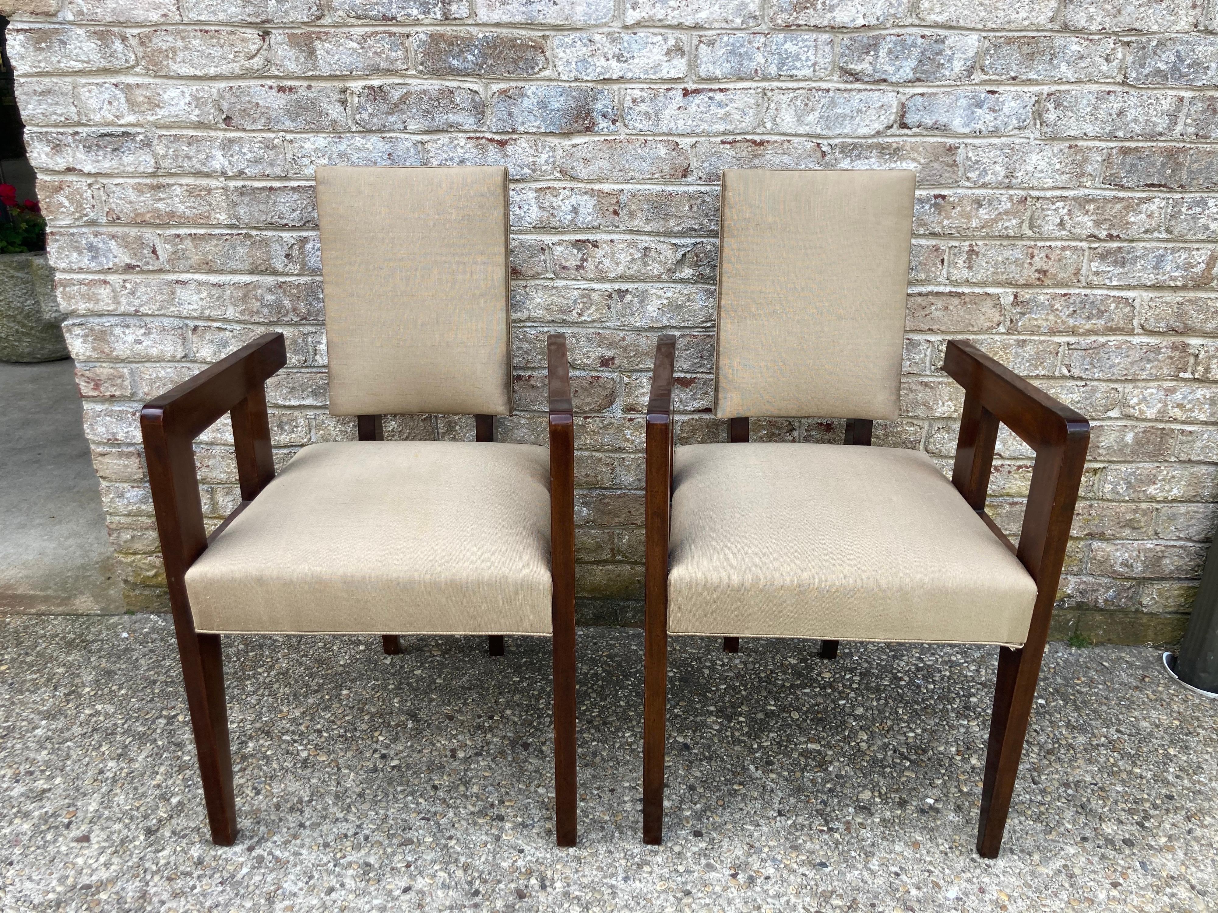 Andre Sornay chairs with arms and silk upholstered seat and back....