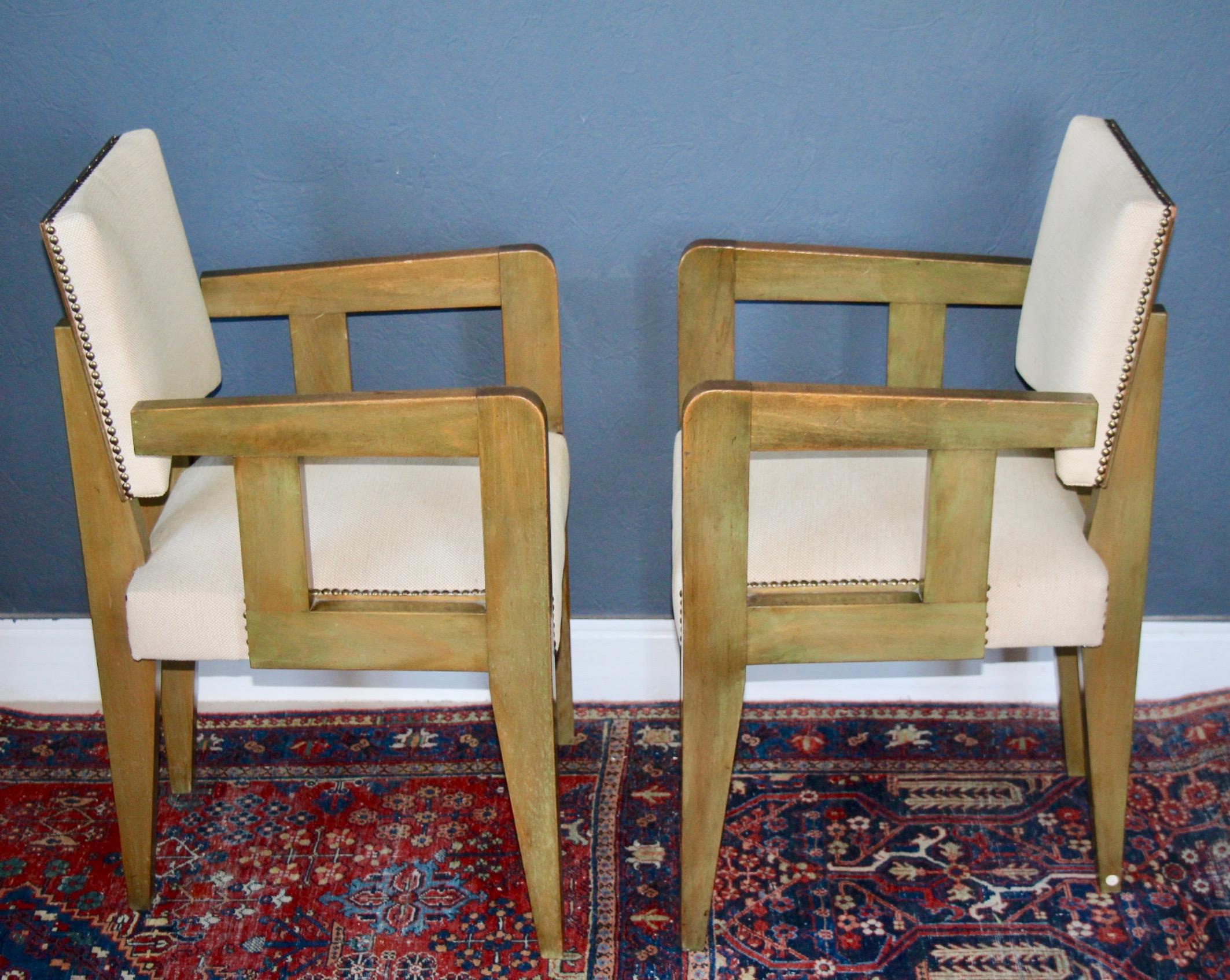 Pair of bridge chairs stained Oregon pine on the back side , lacquer olive green color  wood, brass nail-heads and fabric upholstery, each underside stamped 'BREVETE SORNAY/FRANCE ETRANGER'