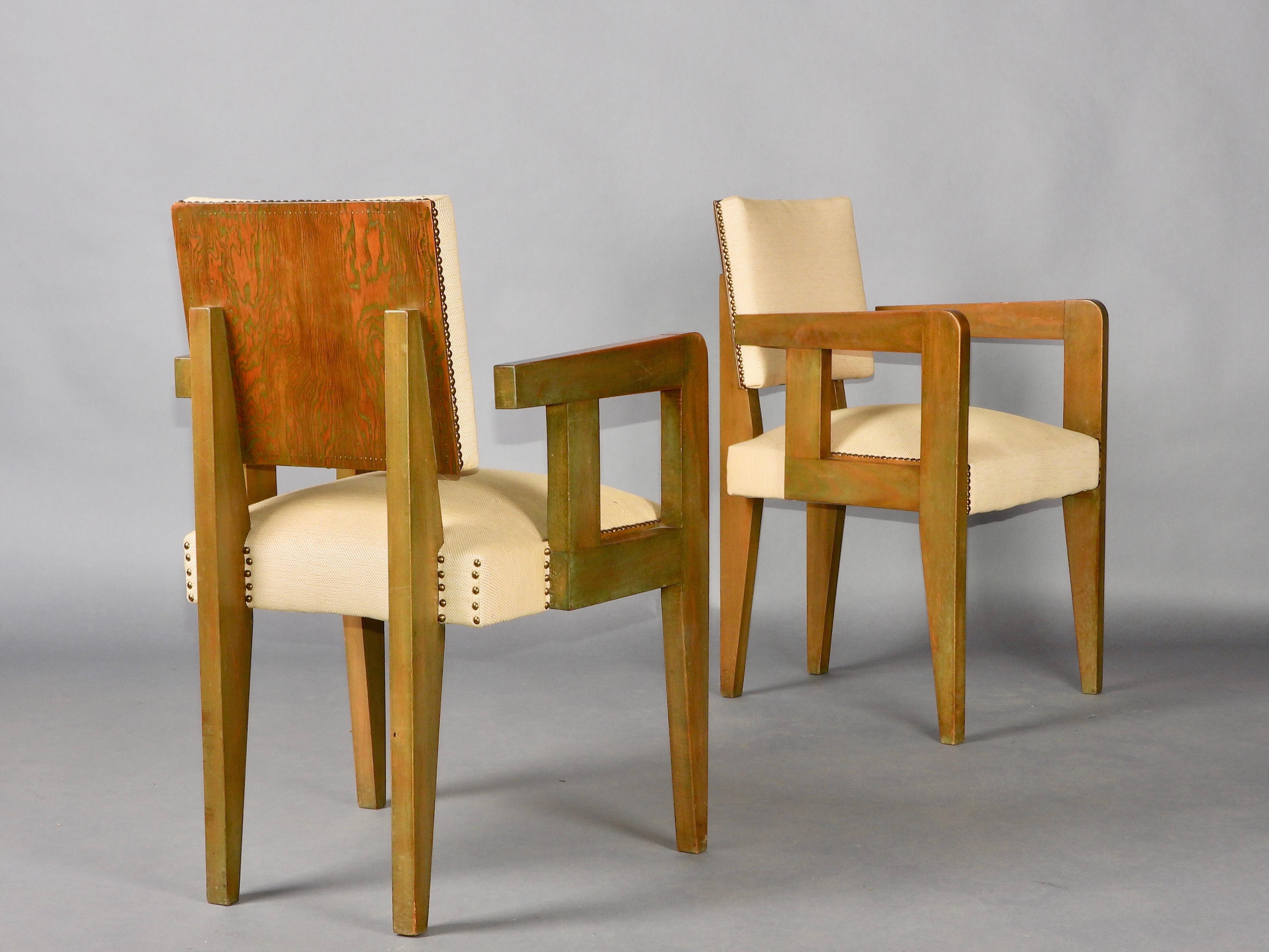Pair of bridge chairs stained Oregon pine on the back side , lacquer olive green color wood, brass nail-heads and fabric upholstery, each underside stamped 'BREVETE SORNAY/FRANCE ETRANGER