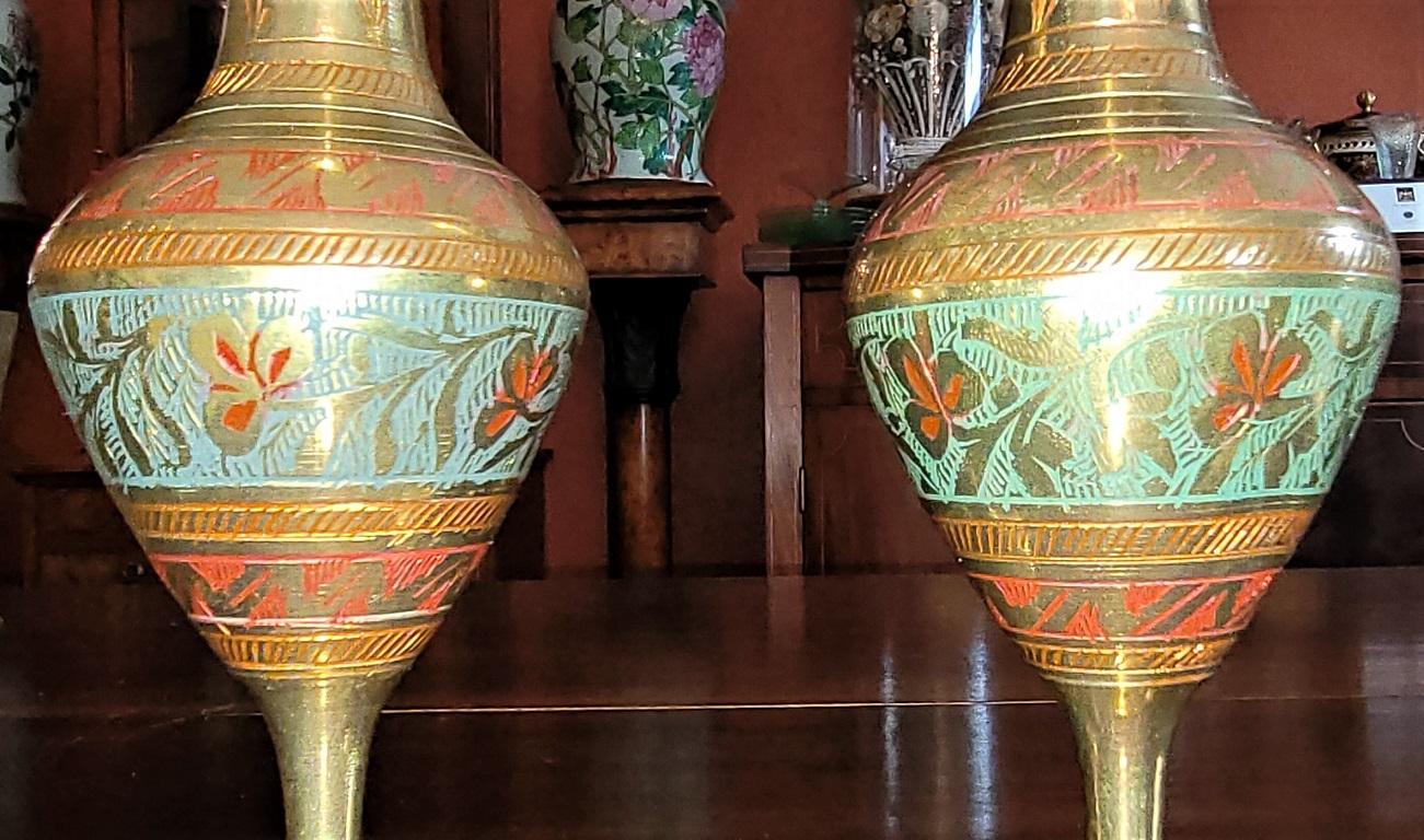 PRESENTING A LOVELY Pair of Anglo Indian Brass and Enameled Rose Vases.

Pretty Pair of Anglo Indian Brass and Enameled Rose Vases.

Hand-enameled in India circa 1900-20, chased brass with red and green engraved and enameled floral design.

Ribbed