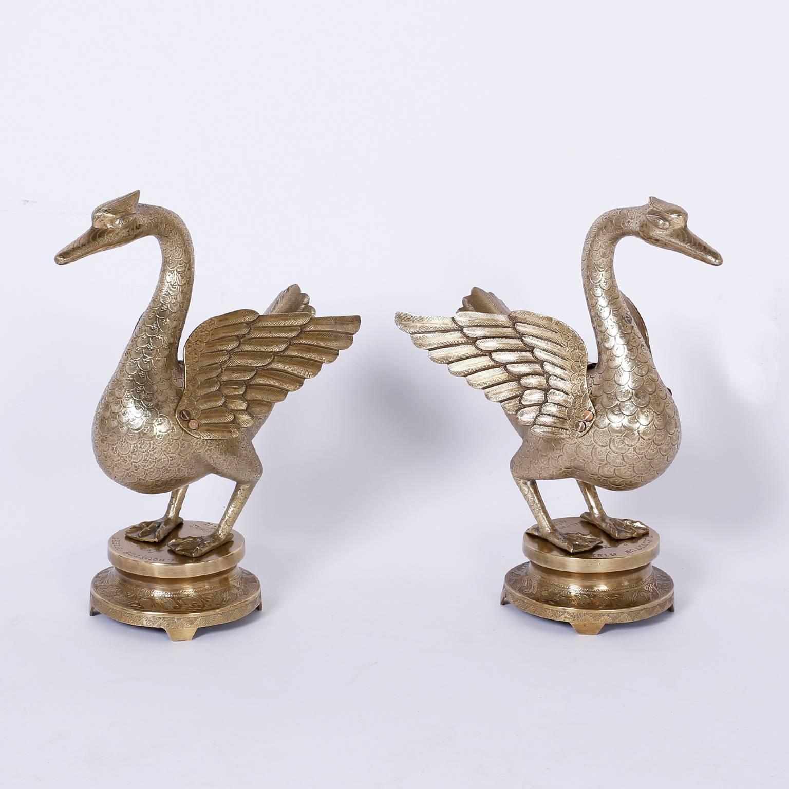 Intriguing pair of antique Anglo-Indian ducks or birds with a
confident stance and engraved details, featuring removable lids and
round classes stands that show evidence these where gifted in 1912.