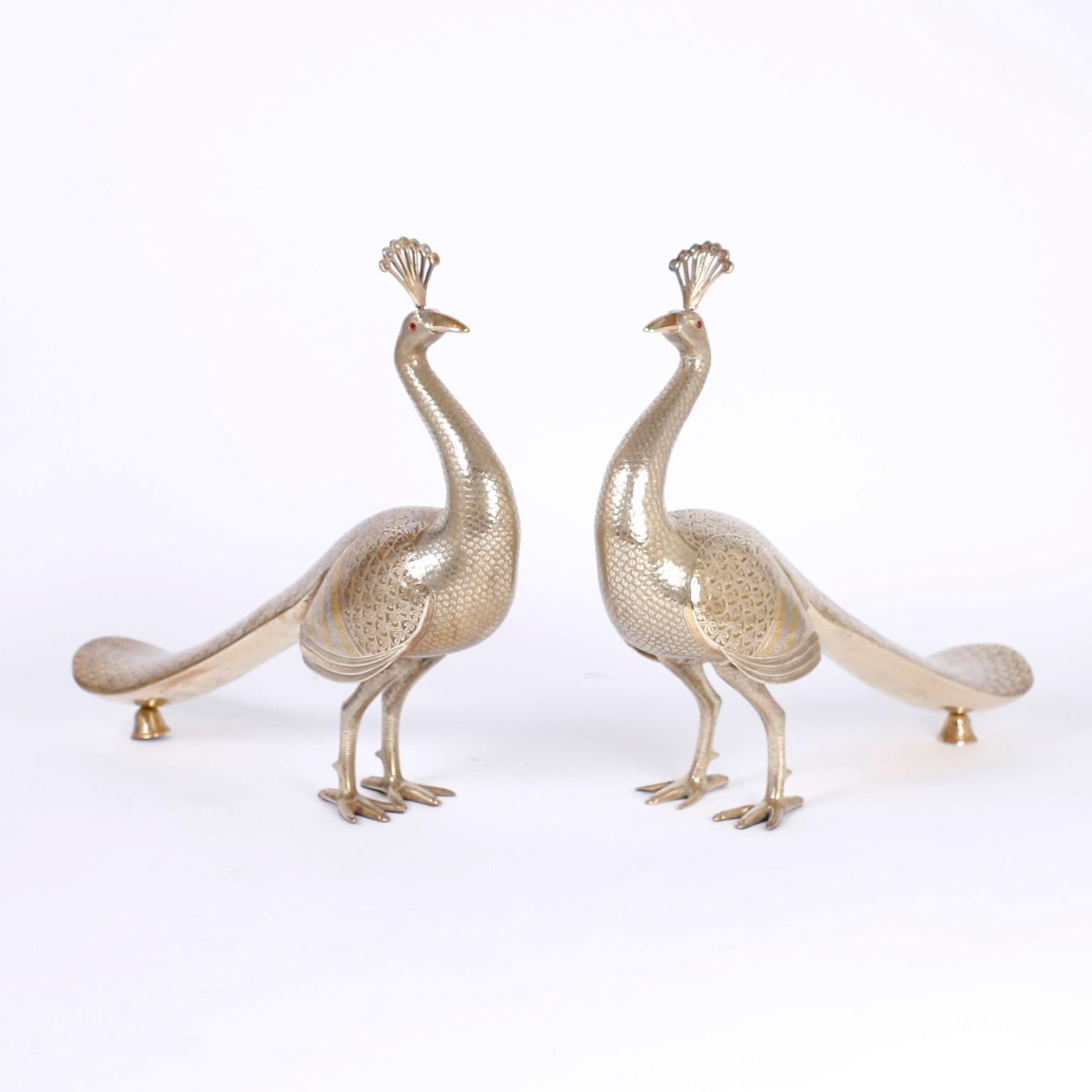 Impressive pair of midcentury Anglo-Indian cast brass peacocks decorated with enamel stylized feathers adorned with cut glass jewels.