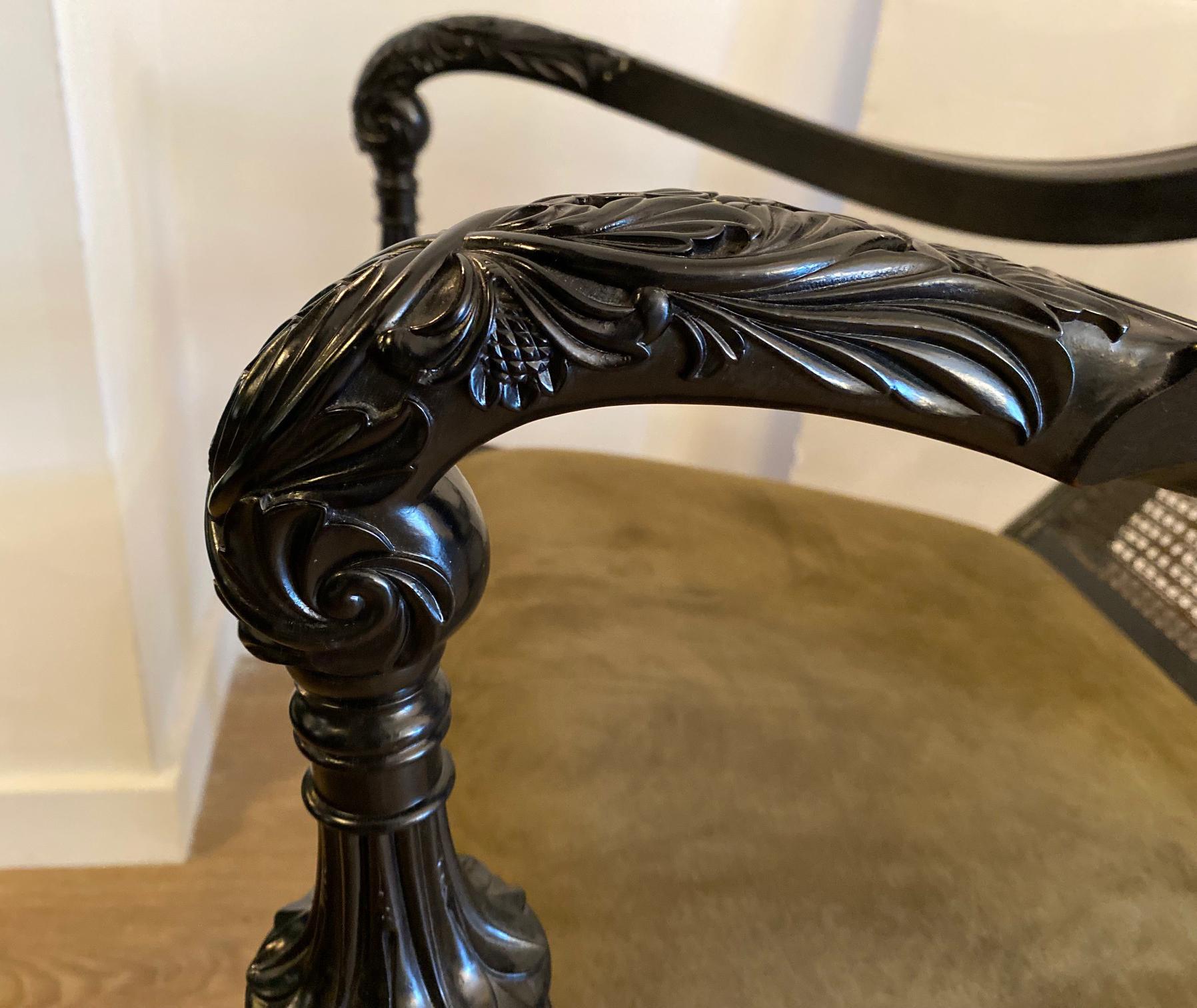 19th Century Pair of Anglo-Indian Carved Ebony and Caned Armchairs For Sale