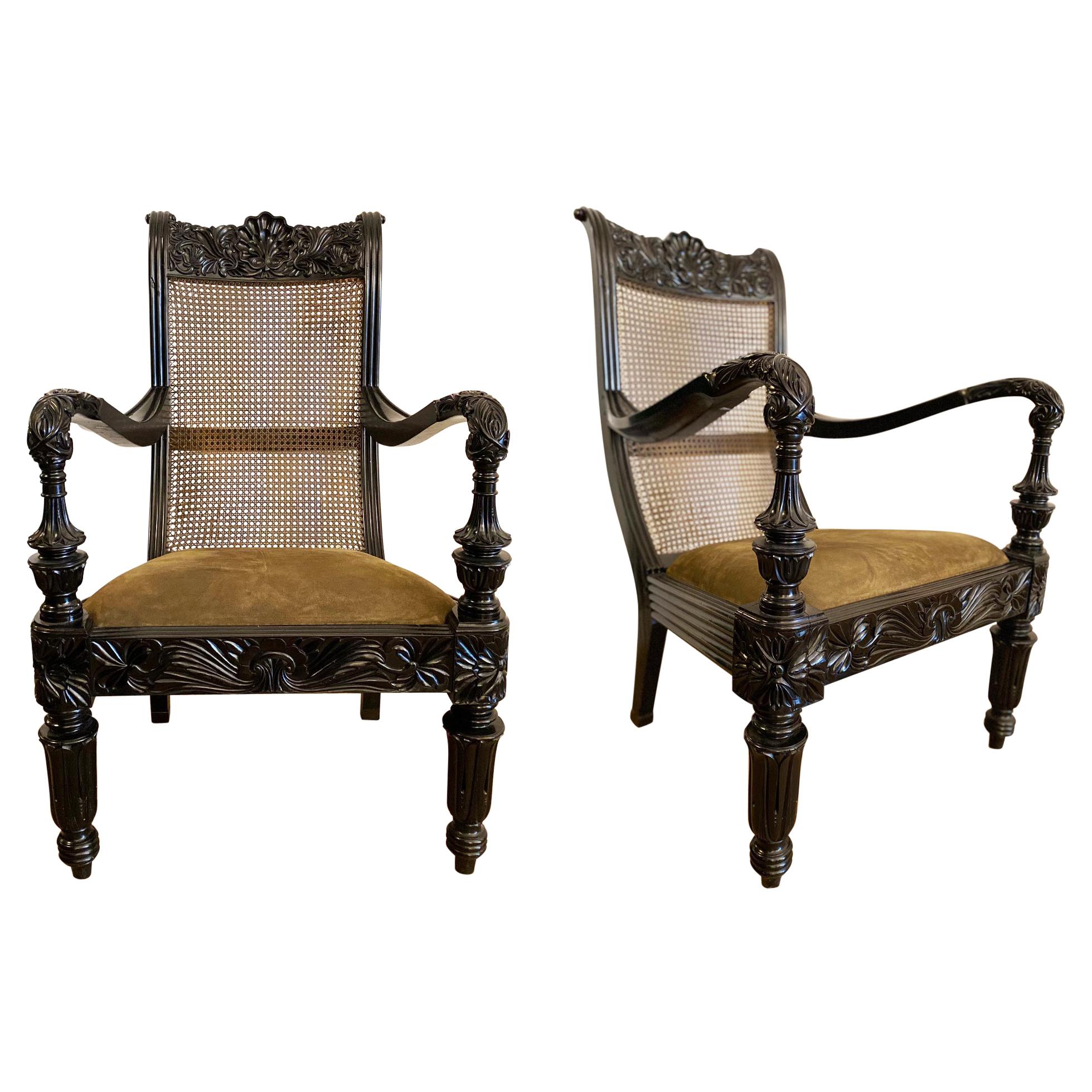 Pair of Anglo-Indian Carved Ebony and Caned Armchairs
