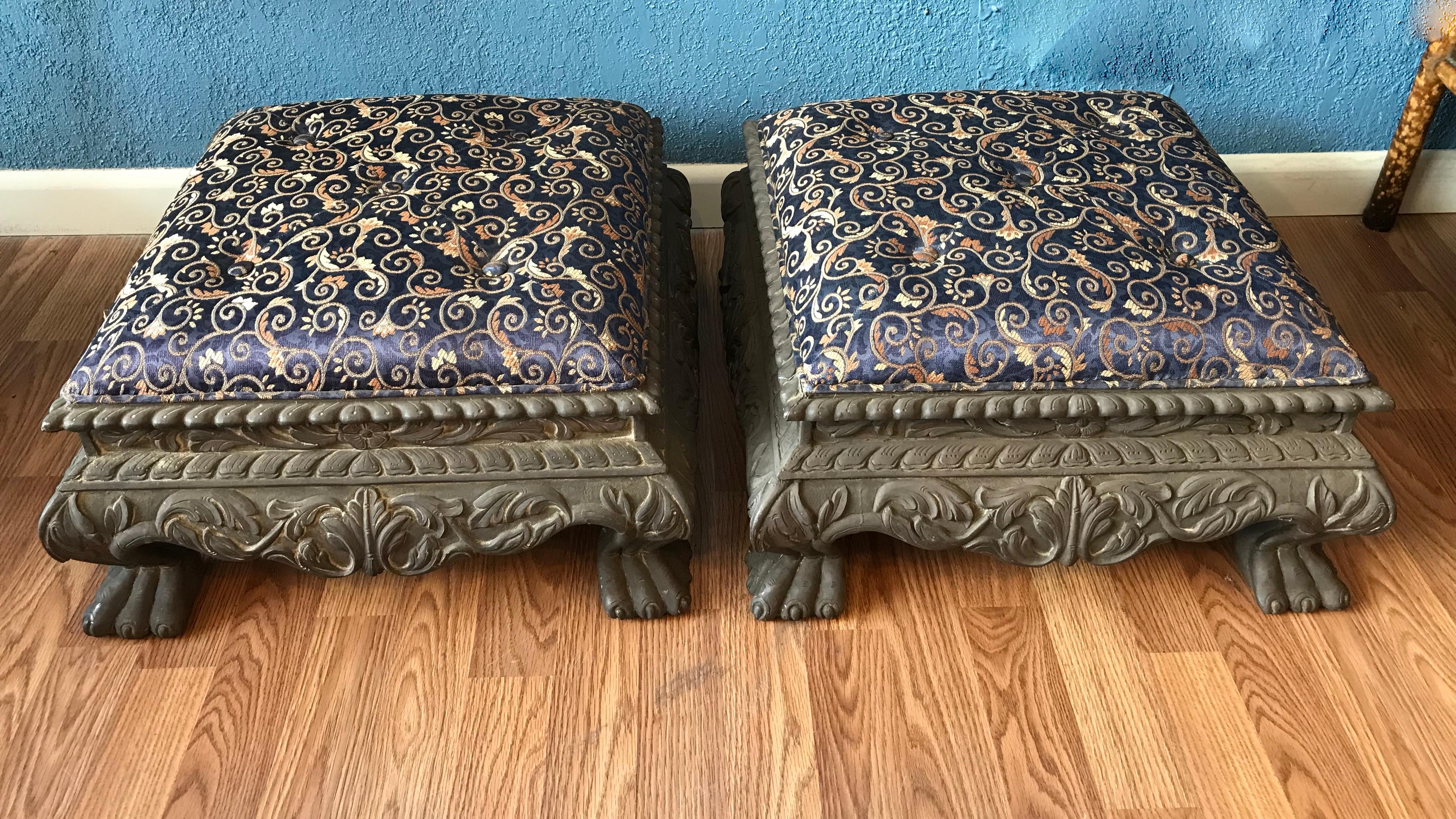 The foot stools are clad in metal and well
defined and detailed. They are accented
with dramatic tiger paw form feet. The frame
work is wood.