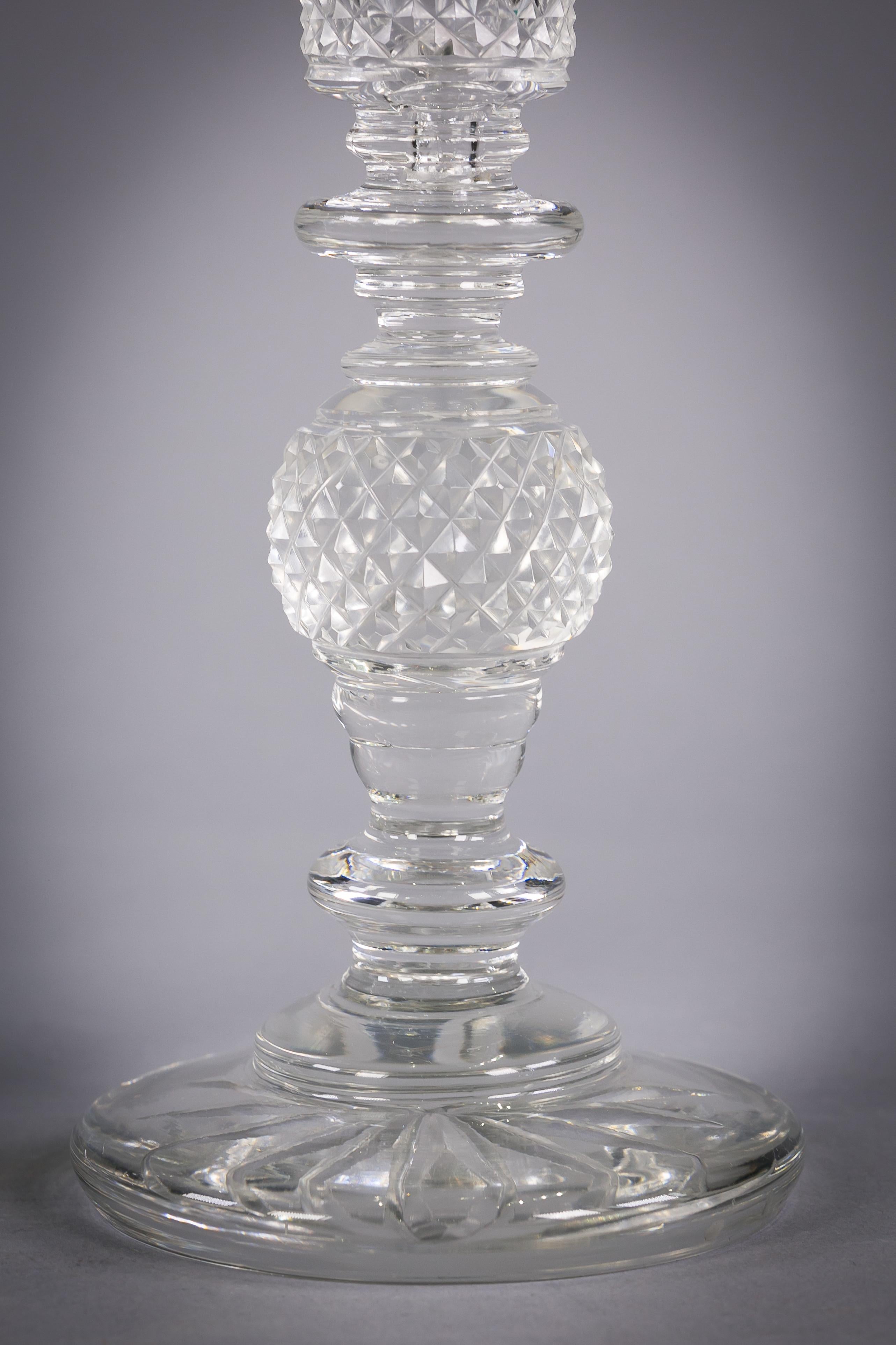 Pair of Anglo Irish cut and faceted glass candlesticks, circa 1820.