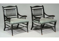 Pair of Anglo-Japanese Ebonized Open Armchairs. Attributed to Jas Shoolbred