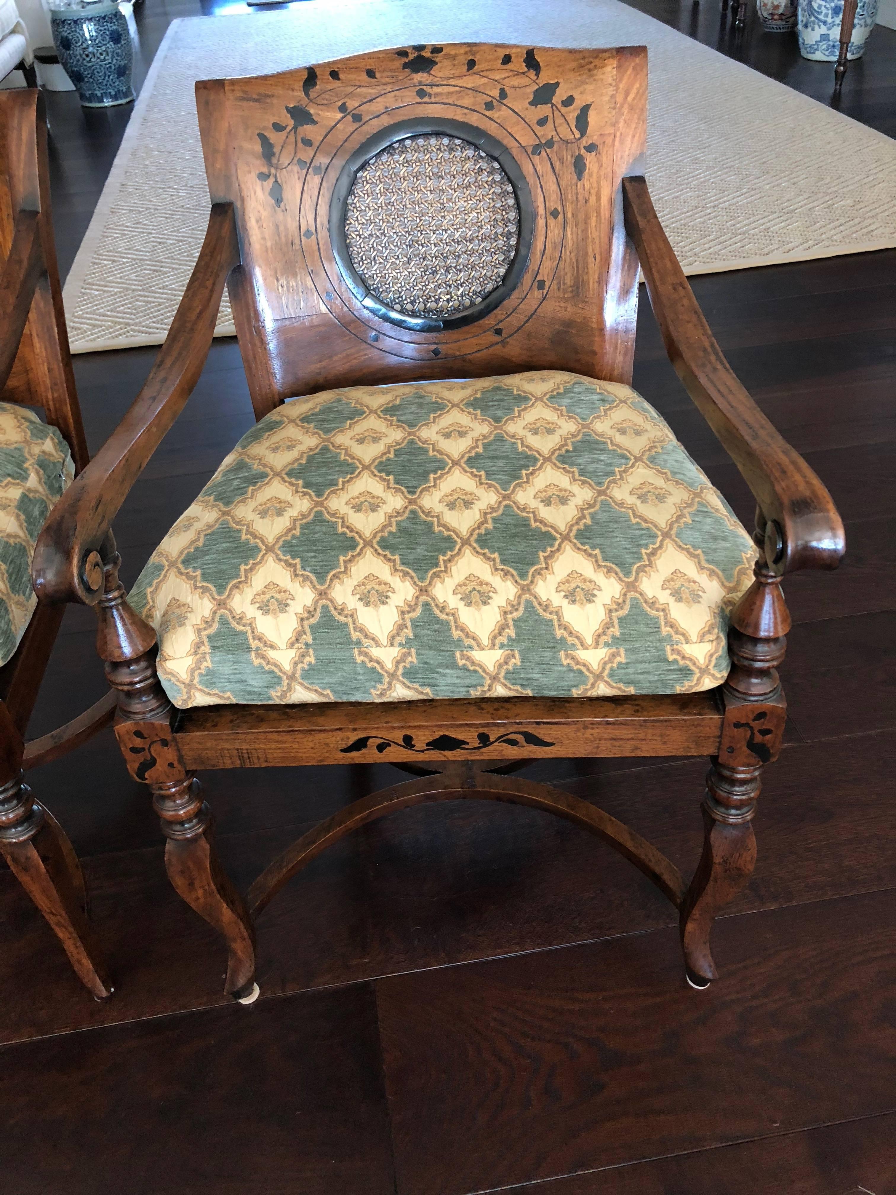 Lovely pair of Anglo-Portuguese armchairs with caned seats and circular caned insert to back having marquetry detail on the back in an ivy vine pattern. The curved legs connected by two curved stretchers. All handmade and handcrafted!