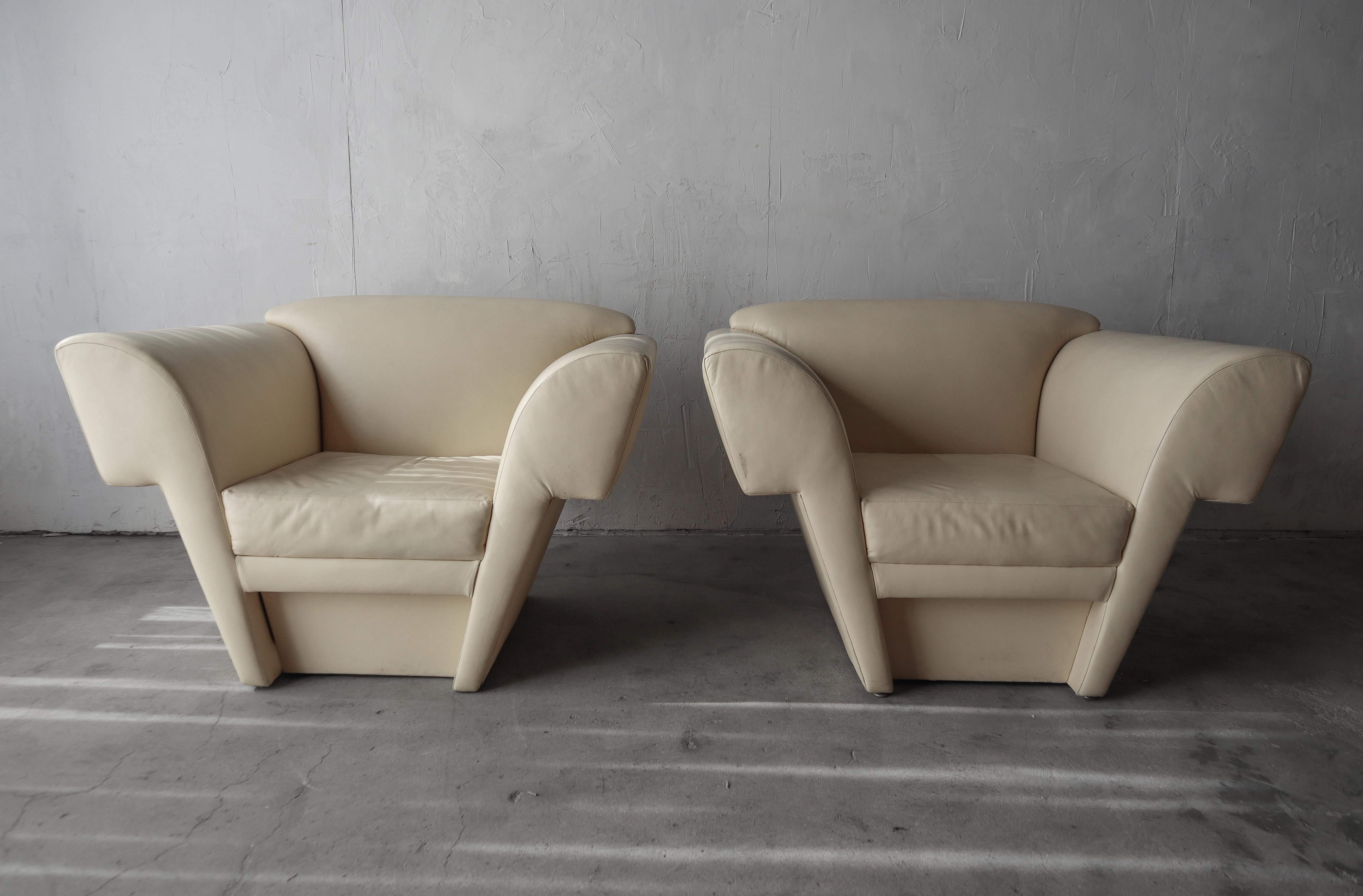 Lines....Lines....Lines

If you are looking for an incredible pair of post modern chairs look no further. The lines of these beauties are about as true post modern as you'll find. 

Although the soft cream colored leather is in fairly good