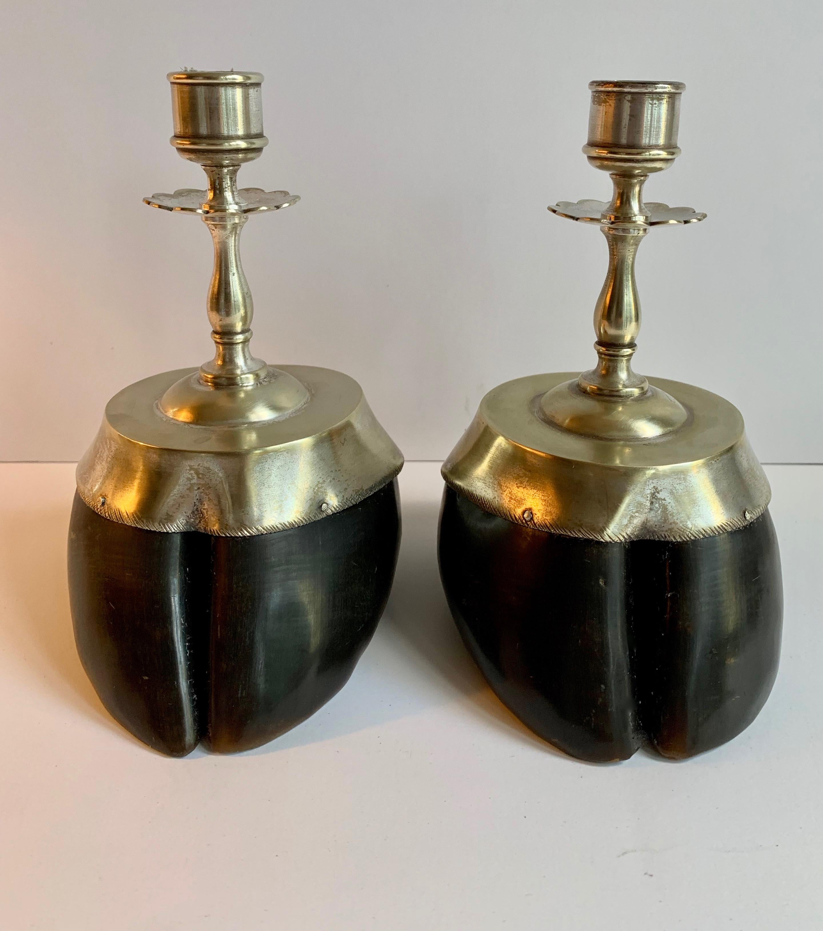 Handsome pair of hoof candlesticks with silver plate details... a perfect compliment to any mantel (fireplace) or dinner table, especially in the rustic room or cabin, but great for the modern space as well! Wonderfully made and detailed.