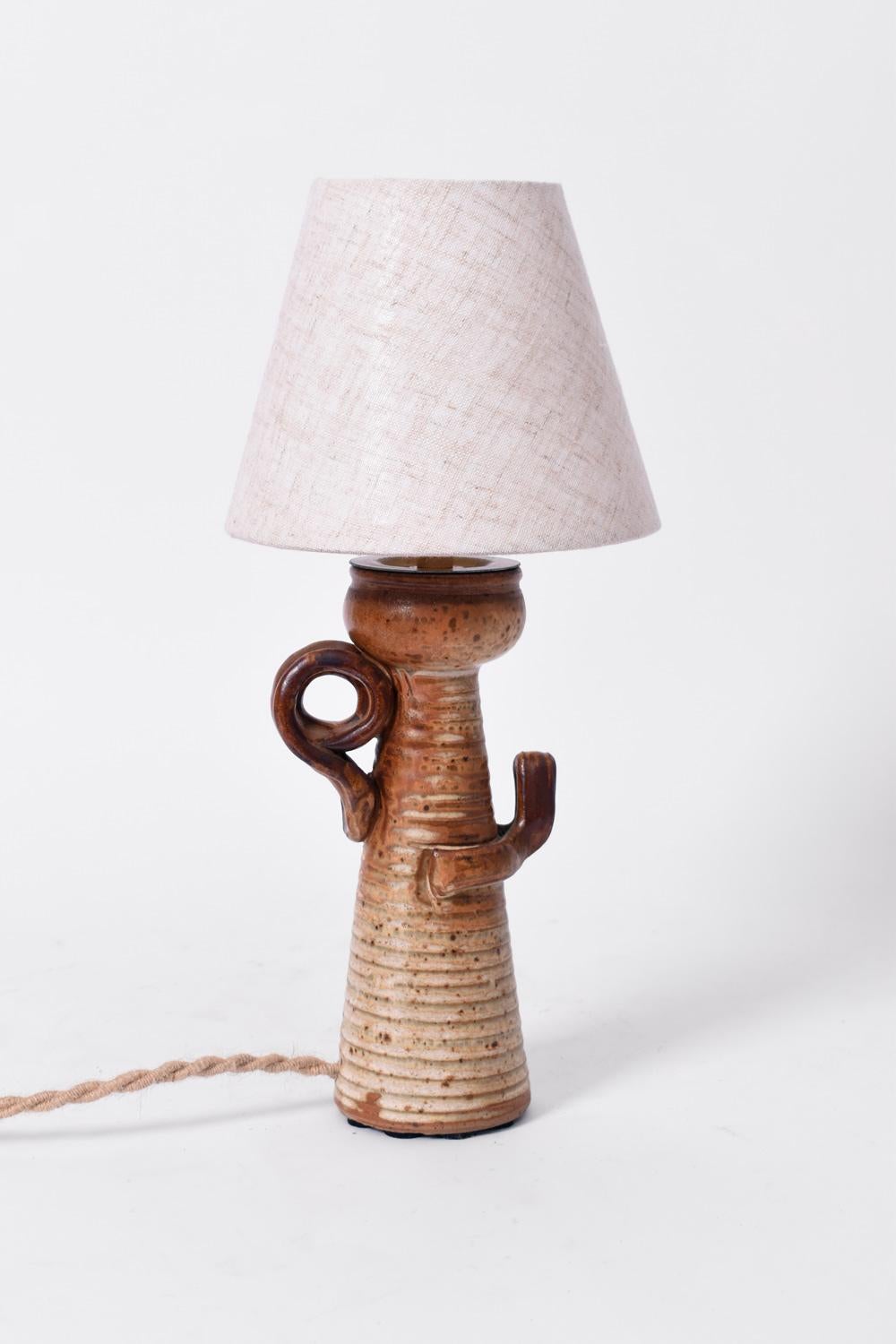 Smaltato Coppia di lampade antropomorfe in argilla, anni '60. in vendita