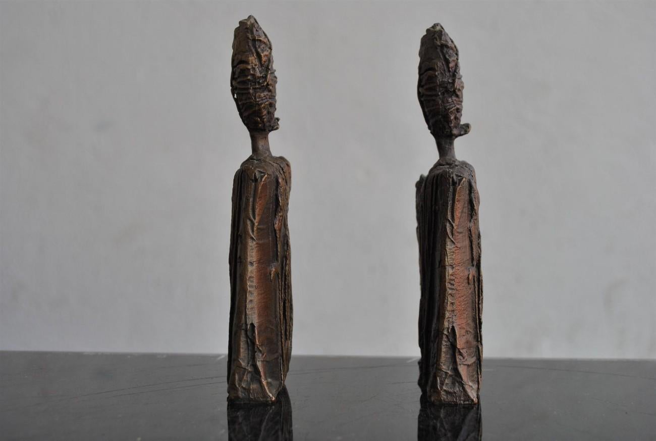 Pair of anthropomorphous bronze by Sebastiano Fini (1949-2003). He lived in Milan until 1978, then went and worked in France and Spain. In the middle of his career (1981-1985), he isolated himself on the island of Panarea where he discovered 