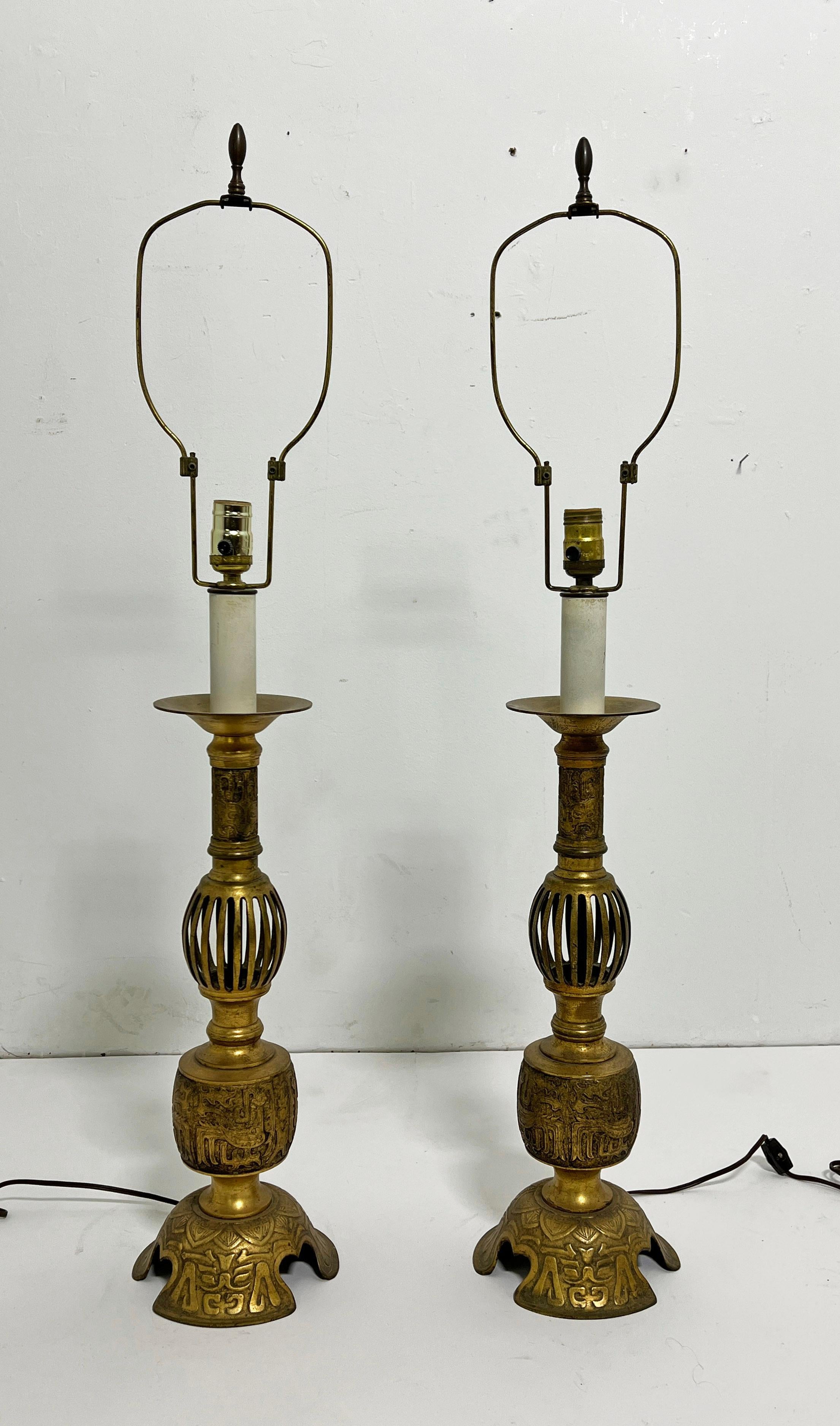 Pair of antique bronze work Chinese candlesticks converted to lamps, ca. late 1800s. 

38