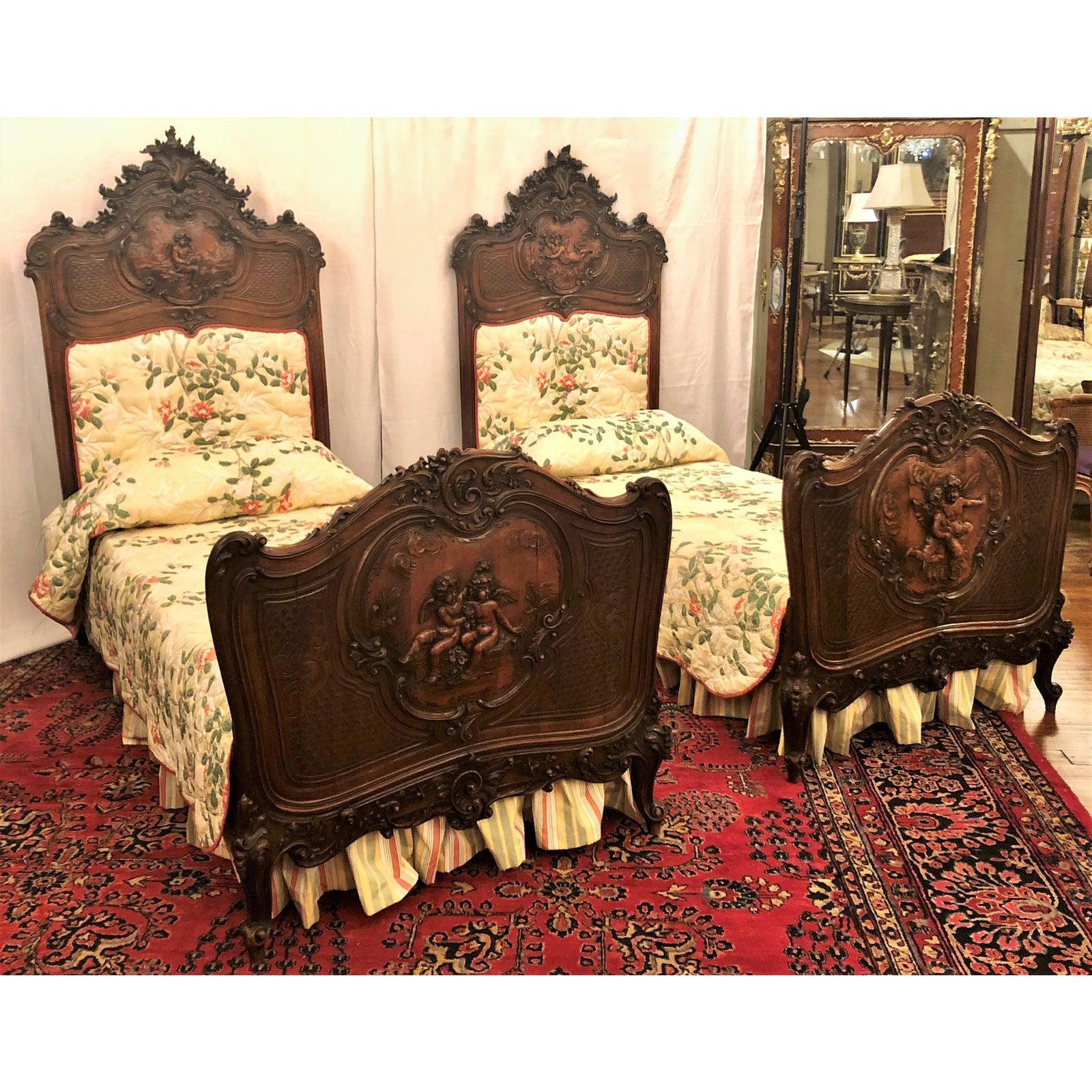 Pair of antique 19th century French walnut beds.