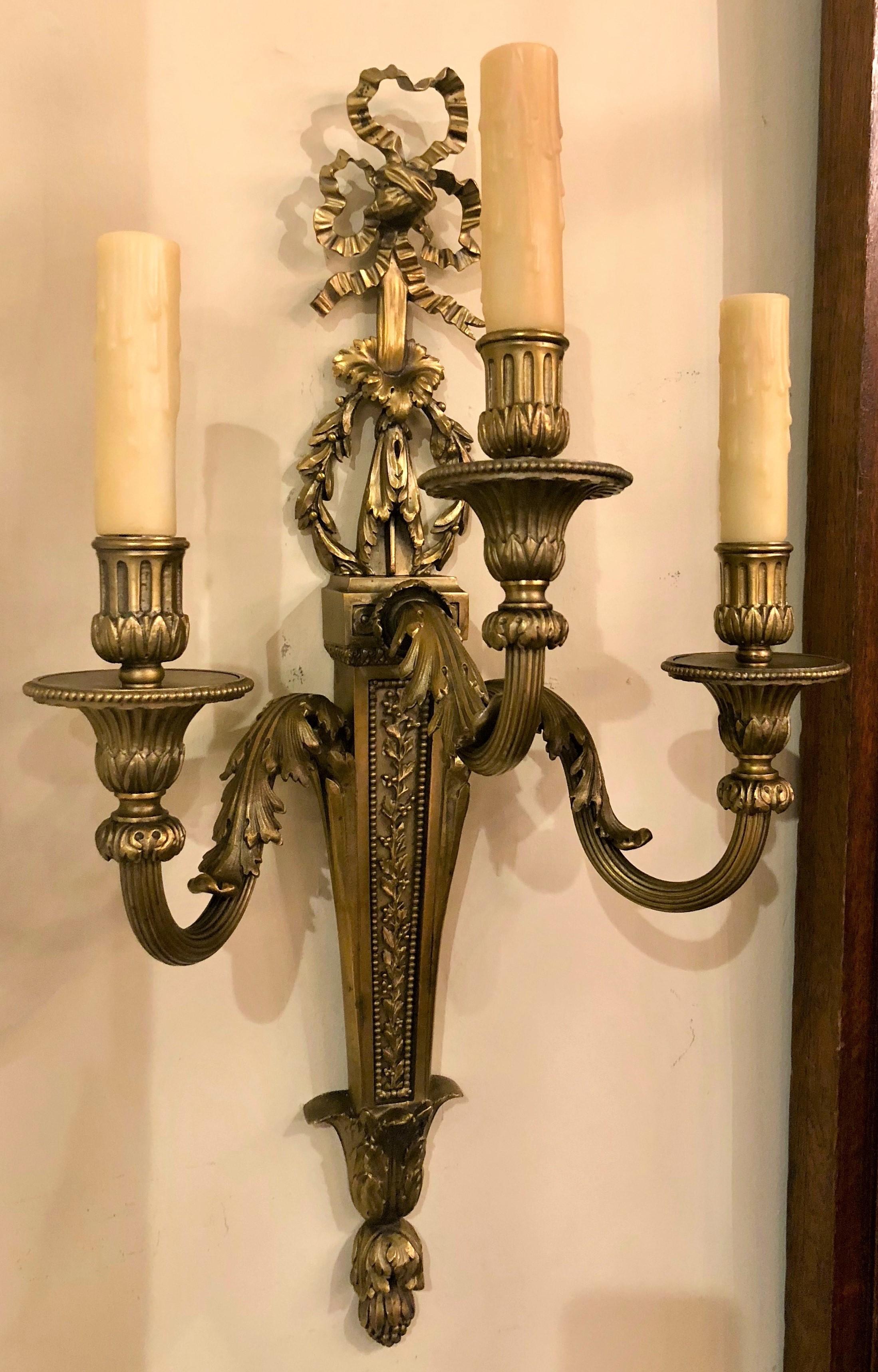 These sconces have been rewired and are ready to grace your walls with their three-light glow.