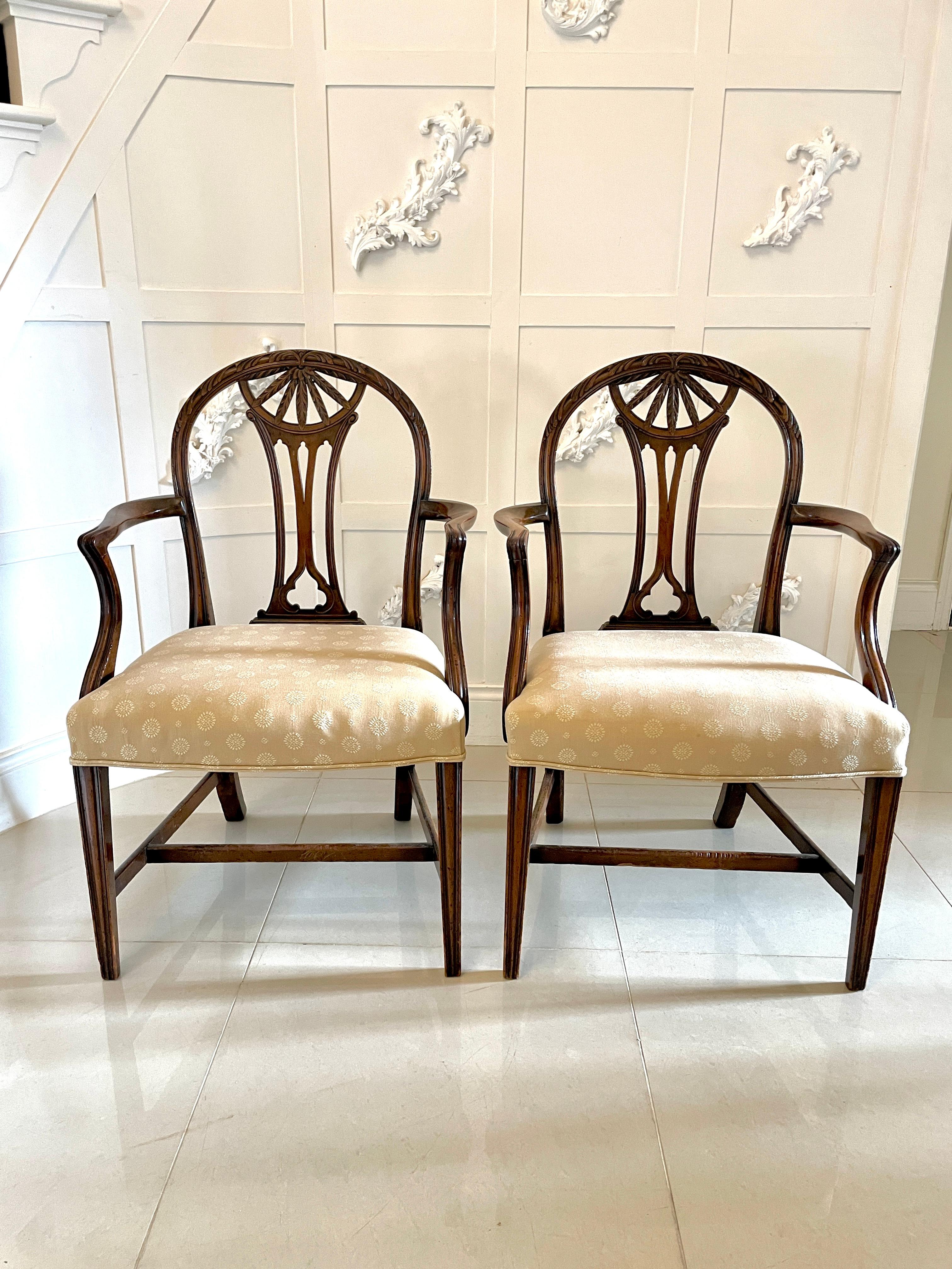 Pair of antique 19th century quality carved mahogany desk chairs having quality carved mahogany shaped backs with a carved pierced centre splat standing on square tapering moulded legs and out swept back legs united by mahogany stretchers.

We are